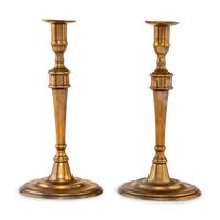 A Pair of George III Bell Metal Candlesticks