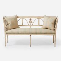 A Northern European cream-painted carved wood settee late 19th / early 20th century