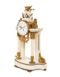 A Louis XVI Style Gilt Bronze Mounted Marble Mantel Clock