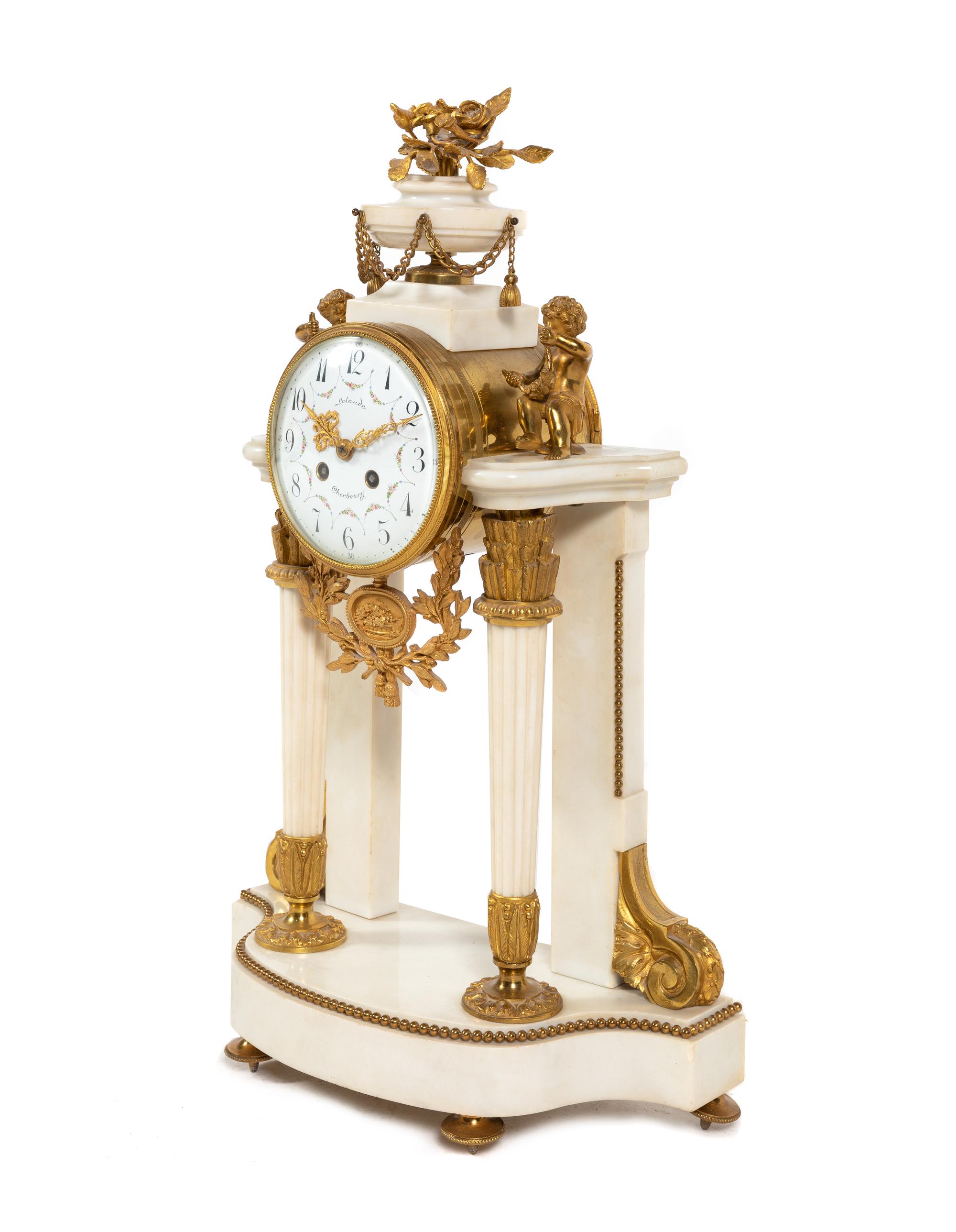 A Louis XVI Style Gilt Bronze Mounted Marble Mantel Clock