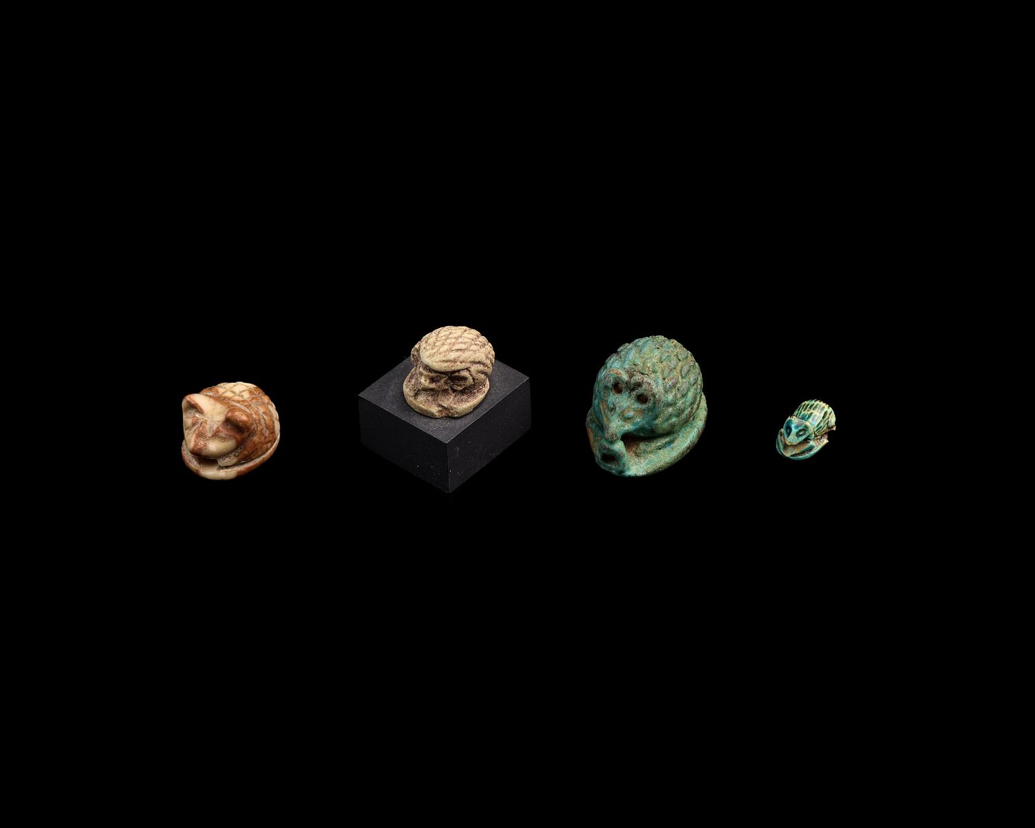 Four Egyptian Faience and Jasper Hedgehog Scaraboids