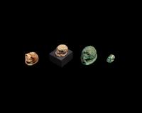 Four Egyptian Faience and Jasper Hedgehog Scaraboids