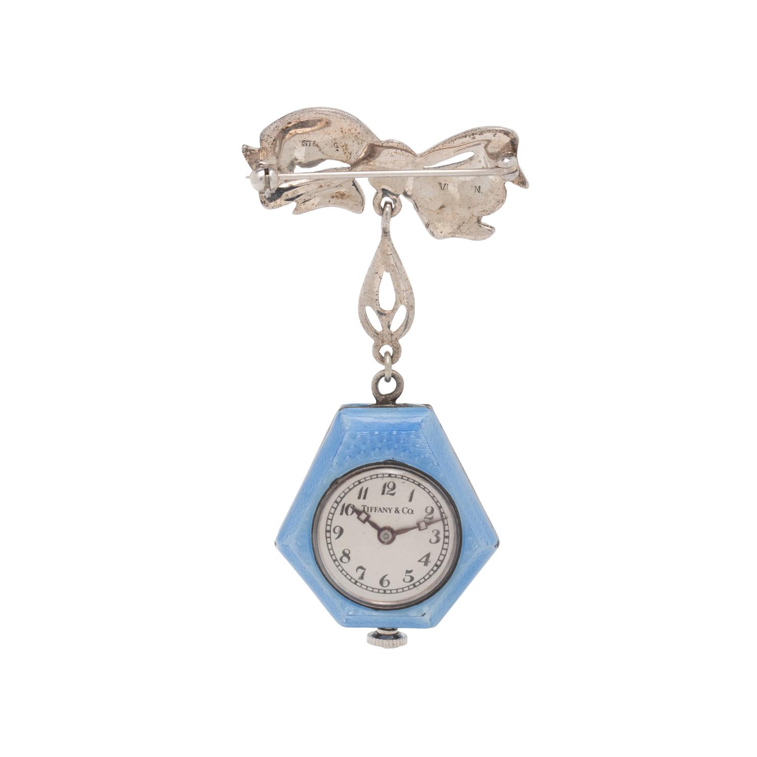 TIFFANY & CO., SILVER AND ENAMEL LAPEL WATCH PIN