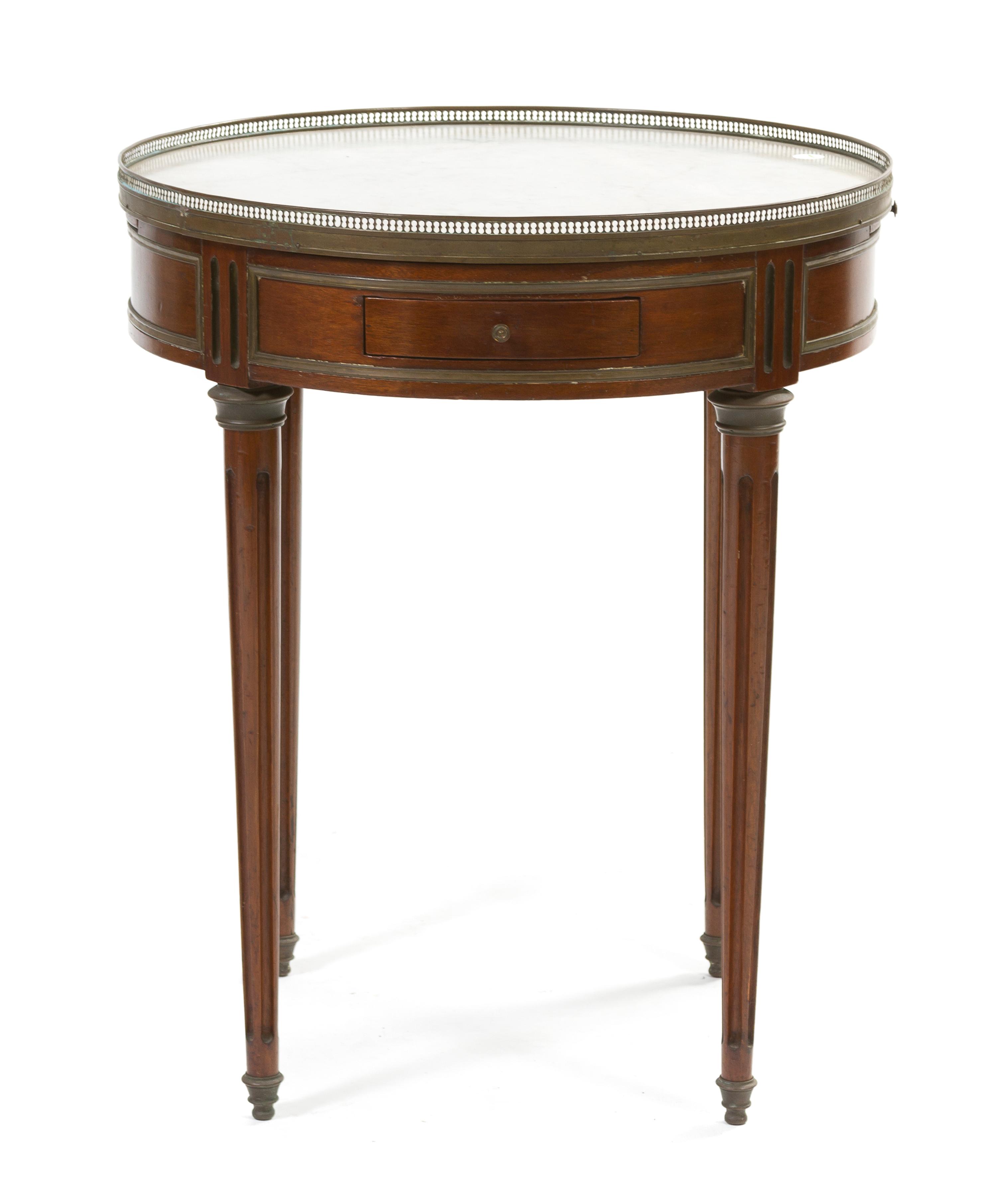 A Louis XVI Style Mahogany Bouillotte Table, Height 28 1/4 x diameter 23 1/2 inches.