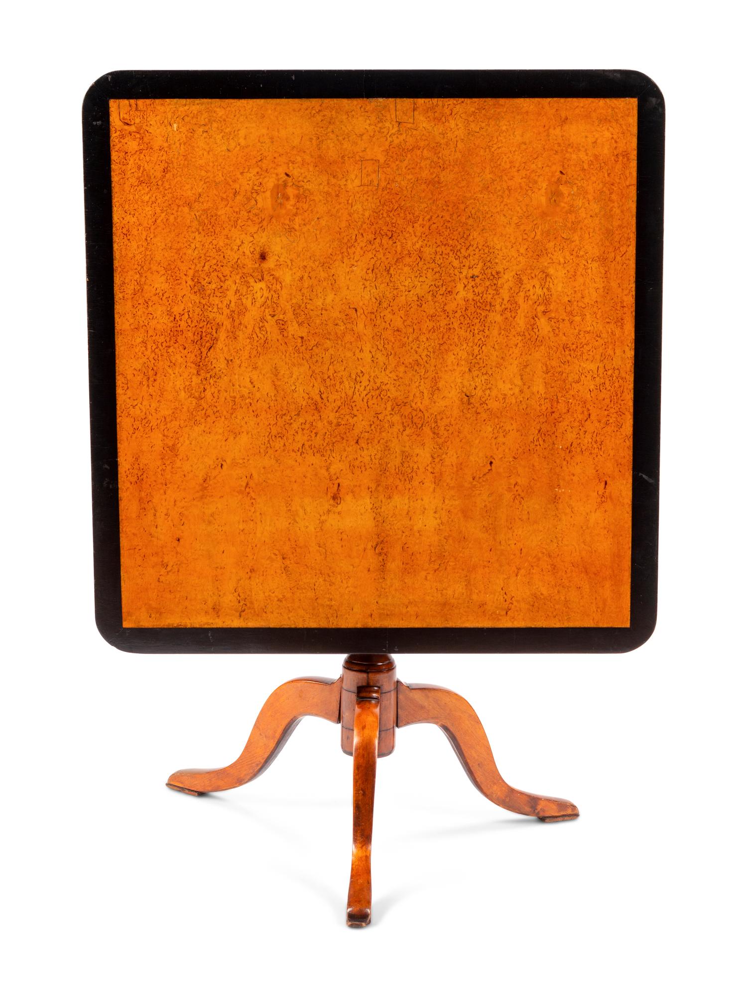 A Swedish Parcel Ebonized Birch Tilt-Top Table