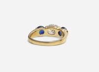 A Three-Stone Diamond and Sapphire Ring