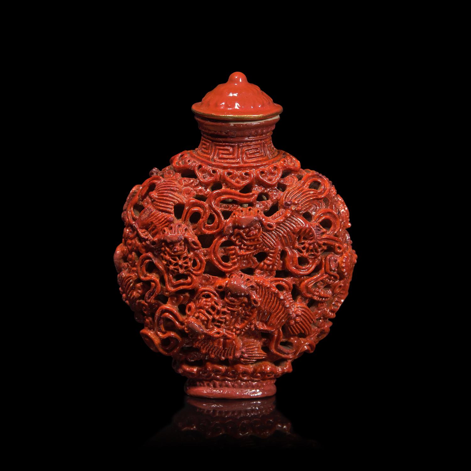 A Chinese Coral Glazed Reticulated Porcelain Snuff Bottle, Jiaqing Mark