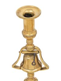 A Group of Four Pairs of English Brass Candlesticks