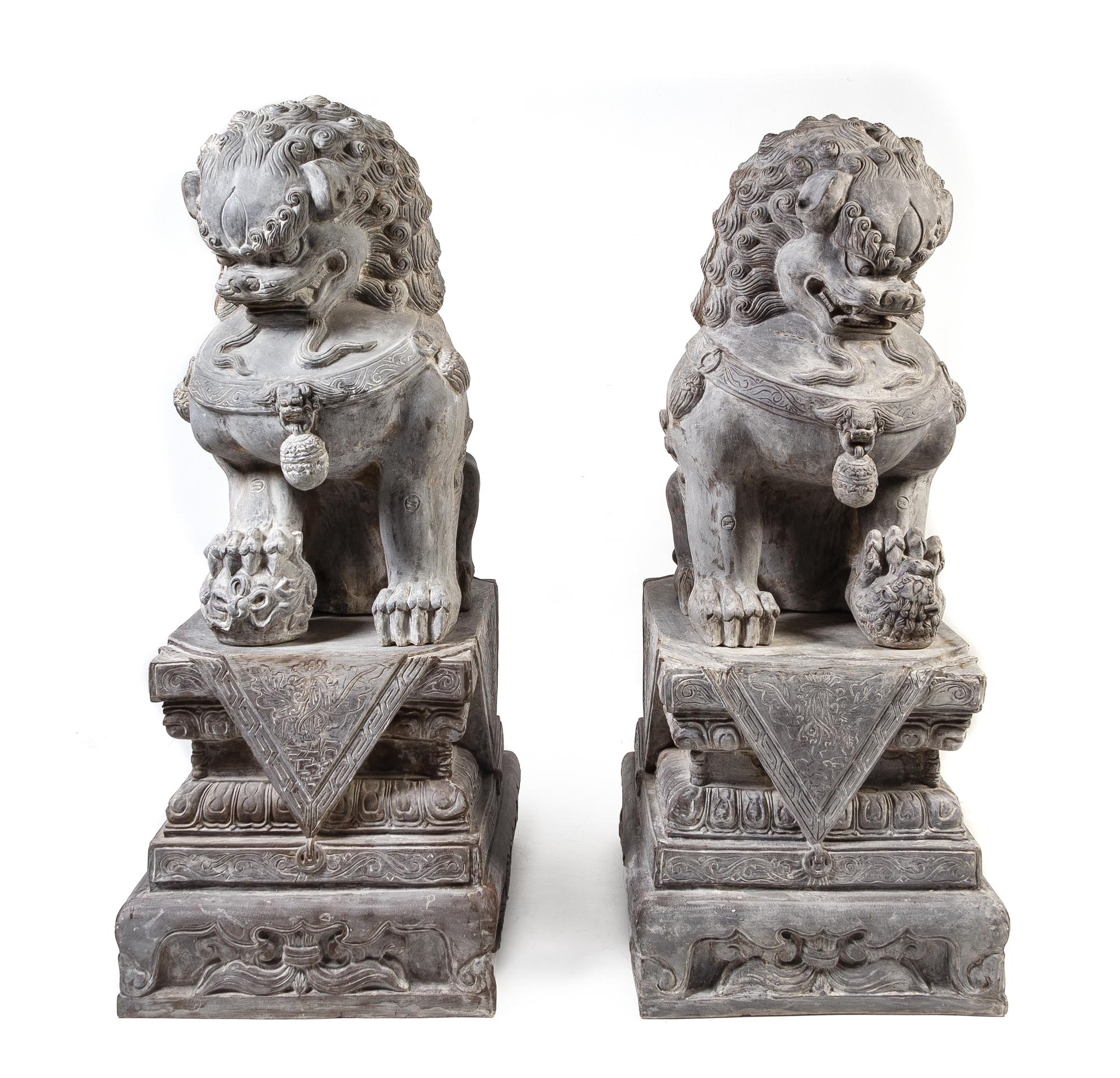 A Pair of Large Composition Temple Guardians Height overall 66 inches. — 20TH CENTURY