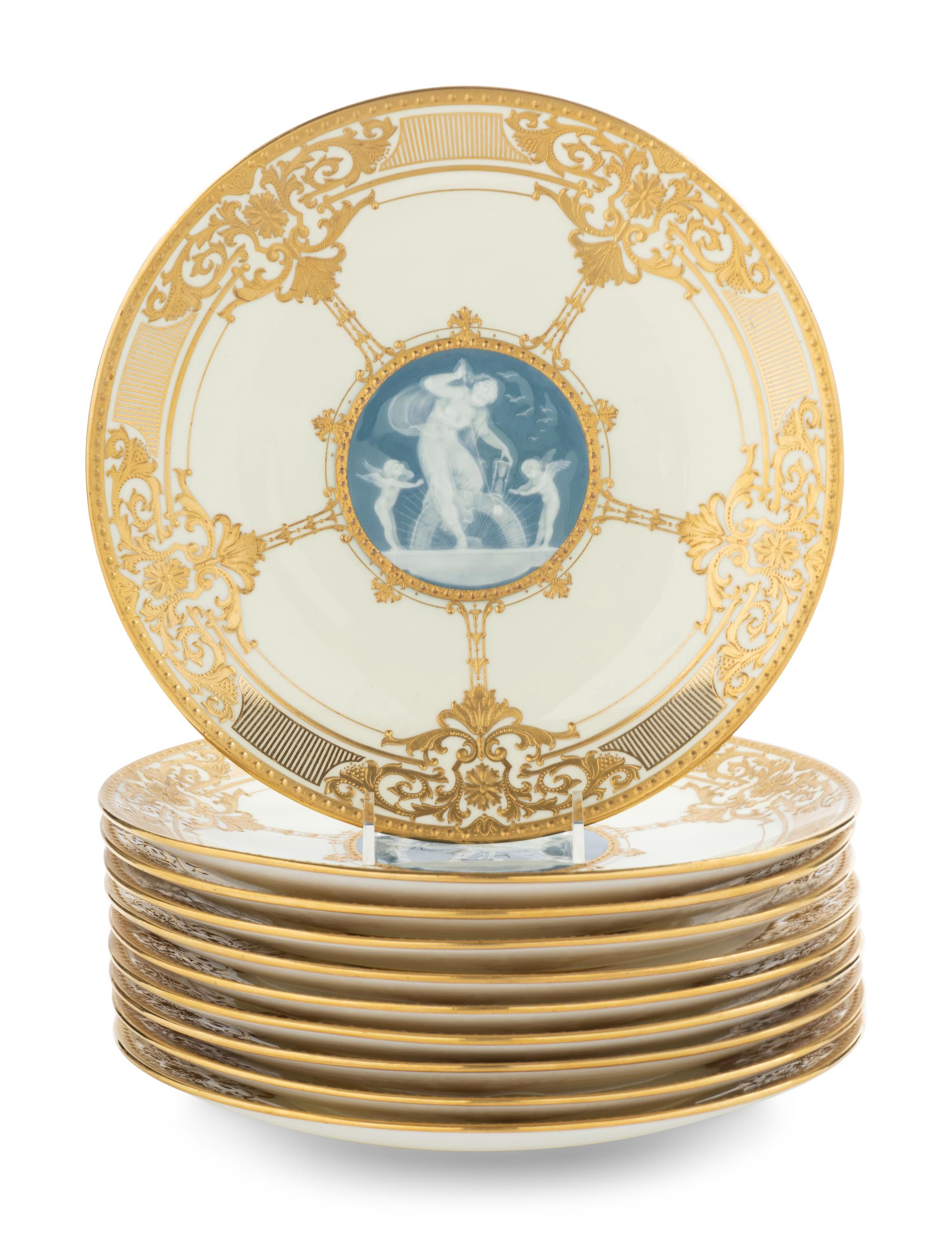 A Set of Ten Mintons Pâte-sur-Pâte Parcel-Gilt Porcelain Dinner Plates