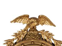 A Federal Style Eagle and Shell Giltwood Bull's Eye Mirror