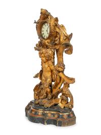 A Continental Carved, Painted and Parcel-Gilt Figural Clock