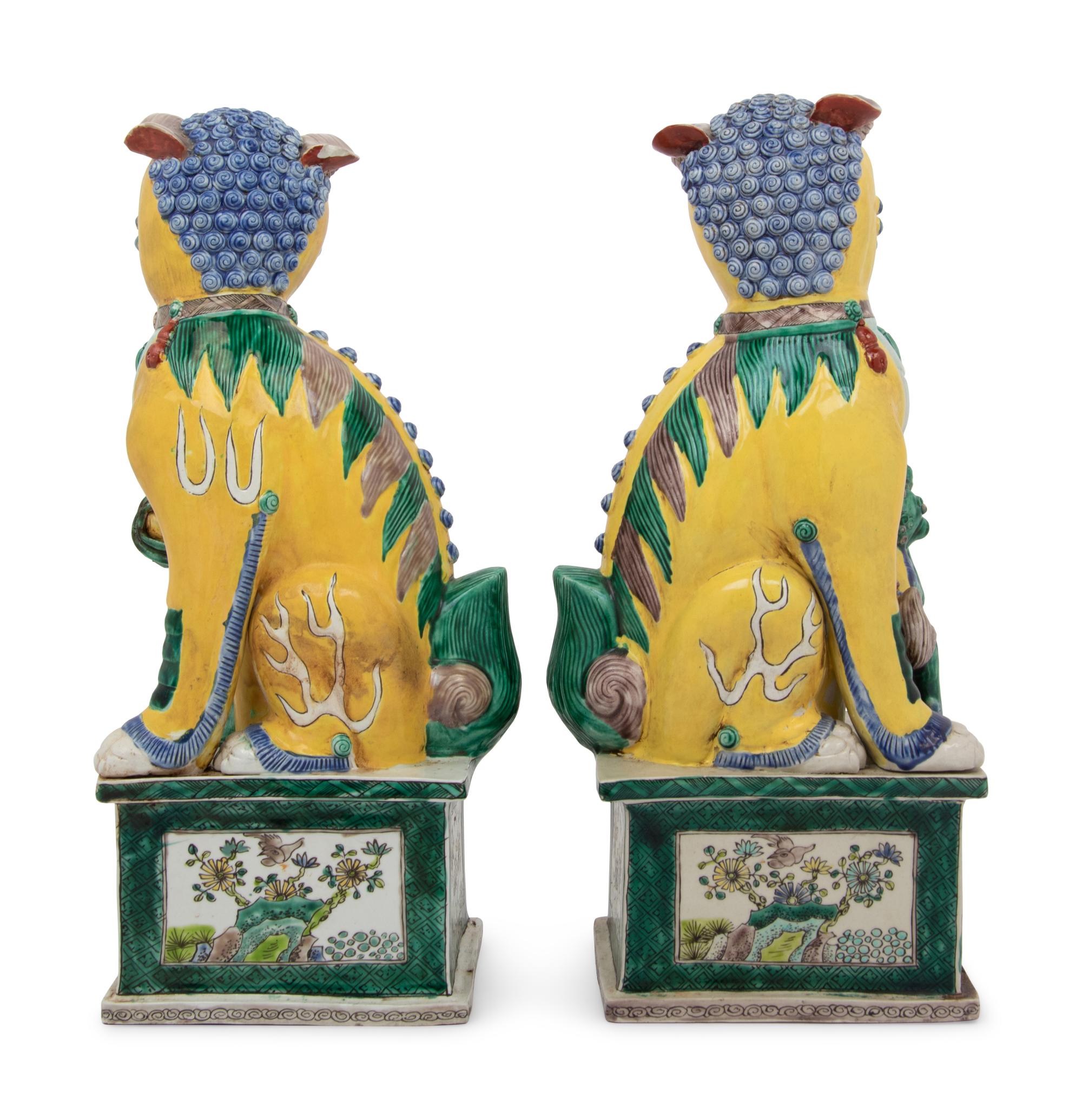 A Large Pair of Chinese Famille Jaune Porcelain Figures of Fu Lions