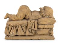 A Concrete Garden Sculpture of a Sleeping Girl