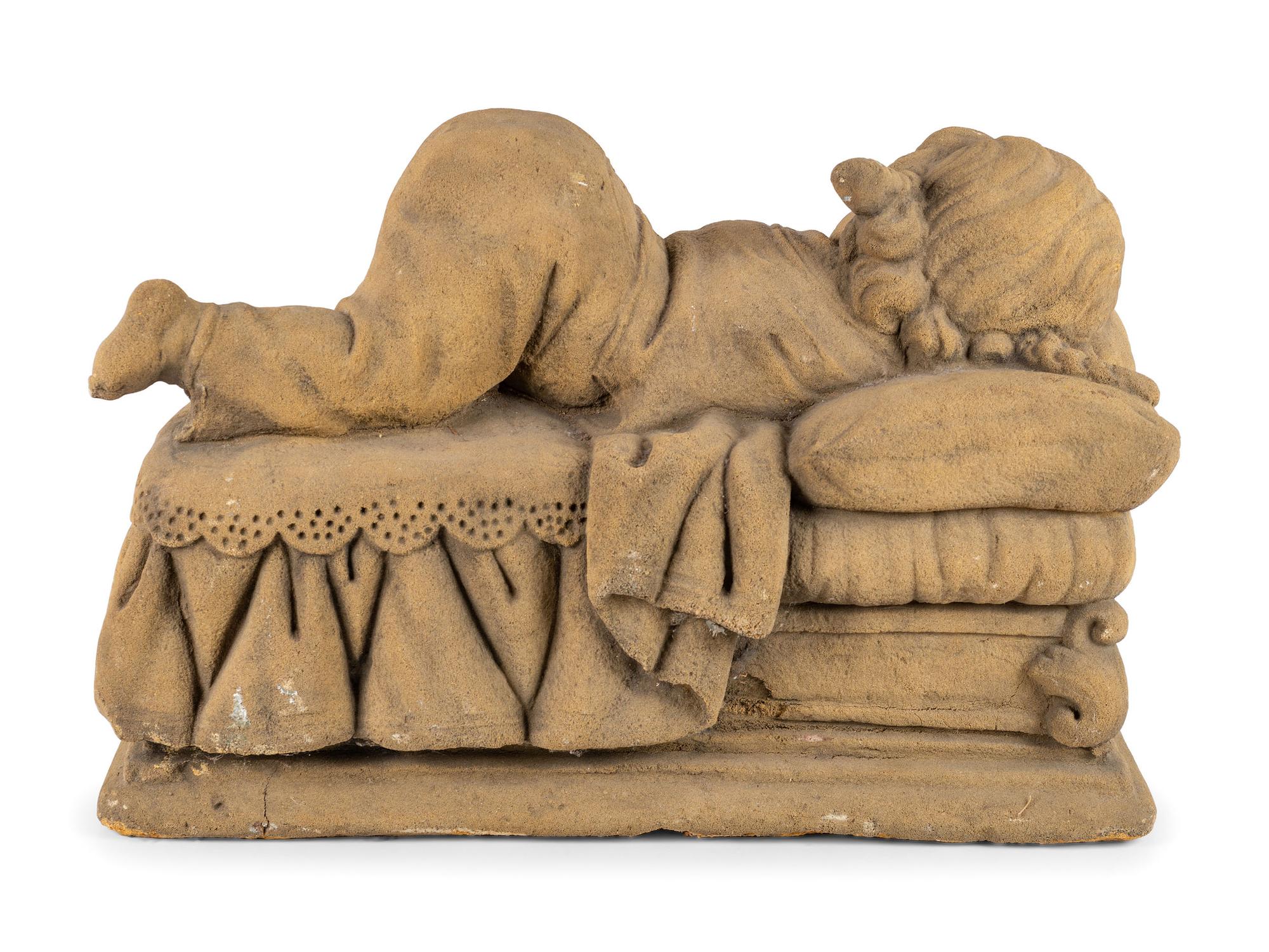 A Concrete Garden Sculpture of a Sleeping Girl