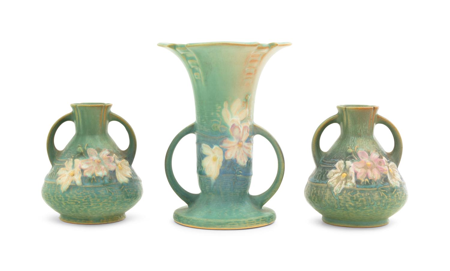 Three Roseville Cosmos Pottery Vases Height of first 6 1/4 inches, pair 4 1/4 inches.