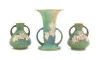 Three Roseville Cosmos Pottery Vases Height of first 6 1/4 inches, pair 4 1/4 inches.