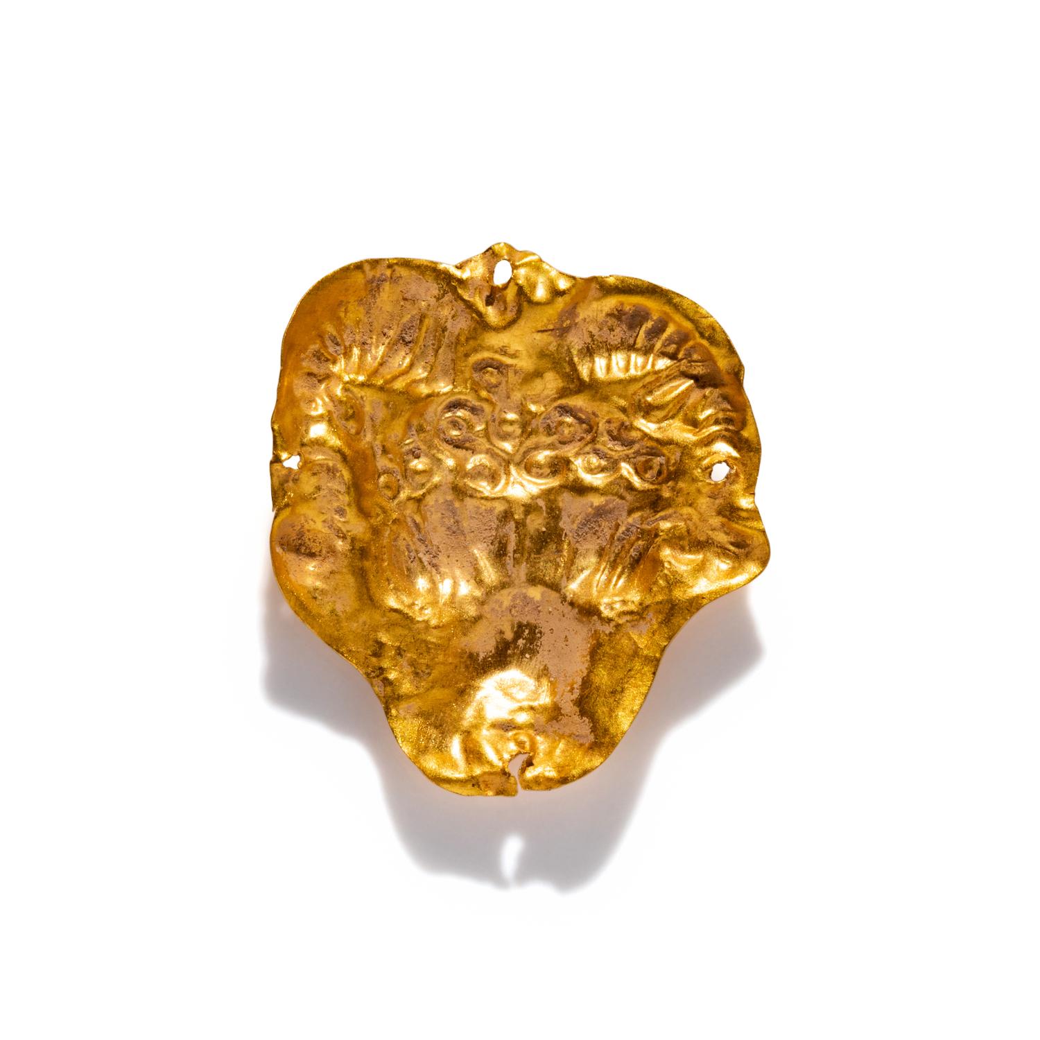 A Near Eastern Gold Ram's Head Applique