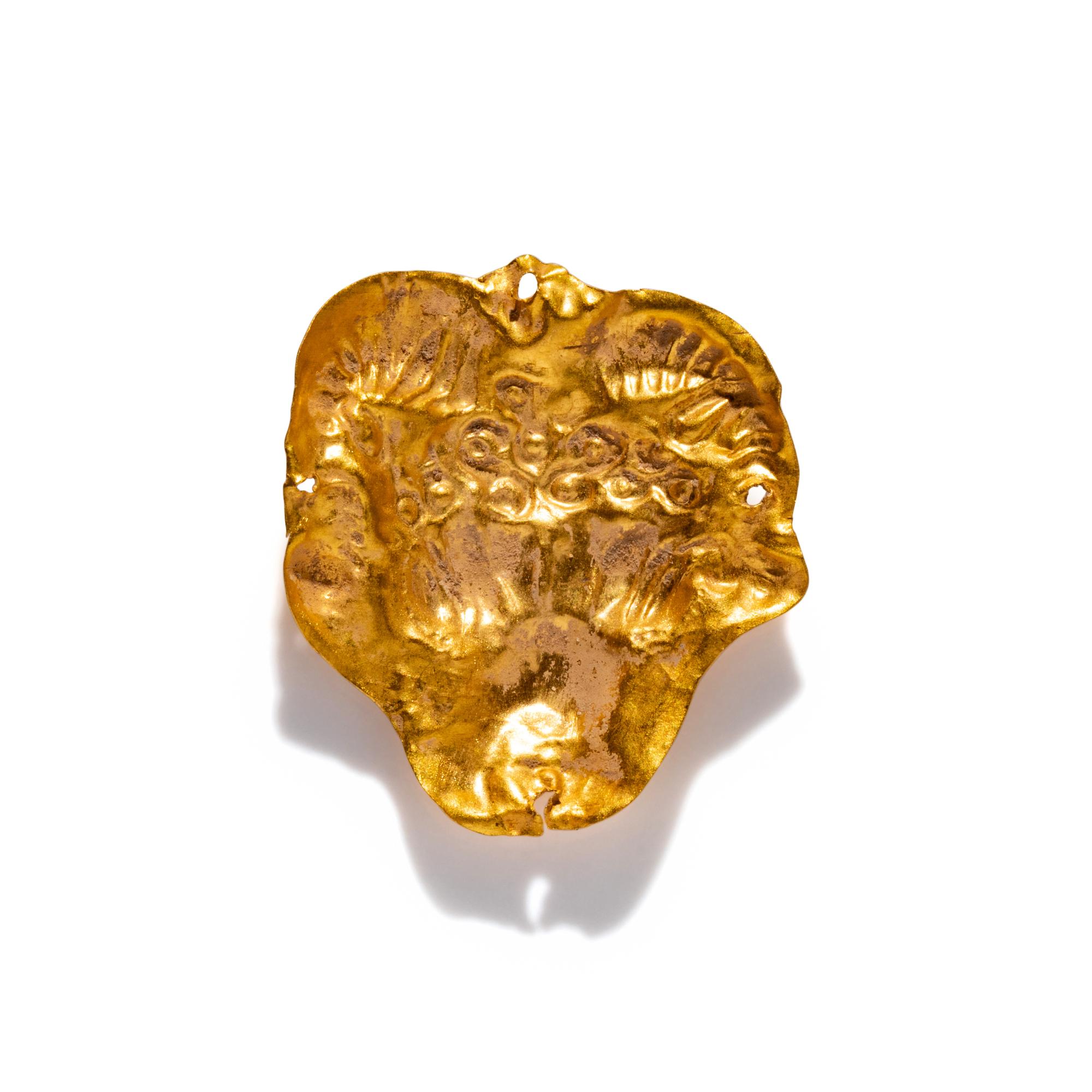 A Near Eastern Gold Ram's Head Applique