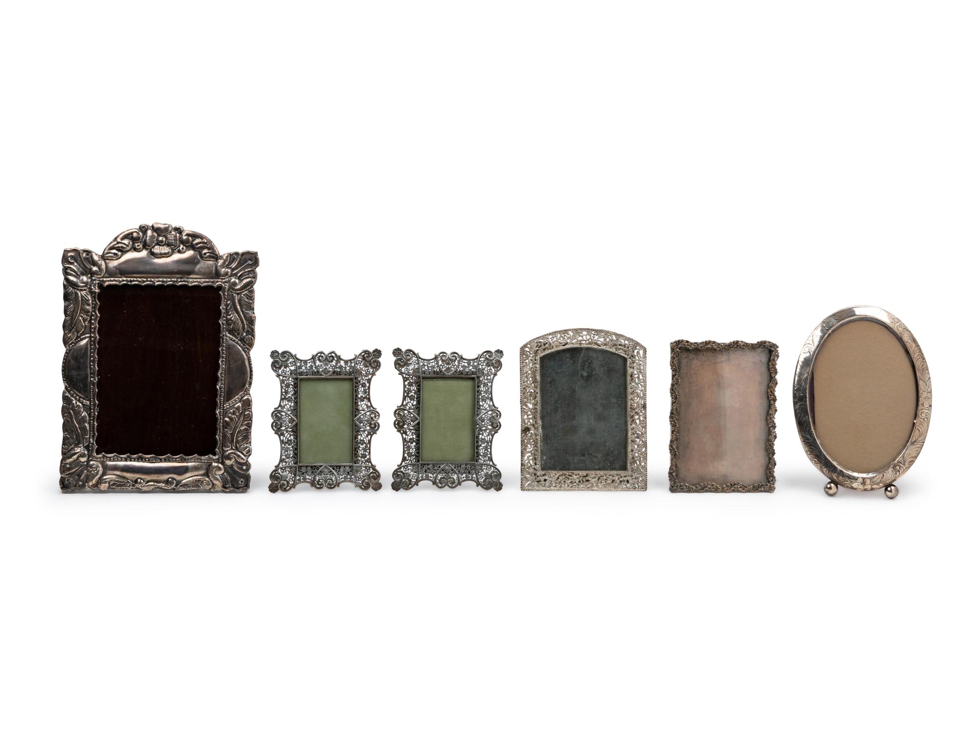 A Group of Six Silver and Mixed Metal Picture Frames