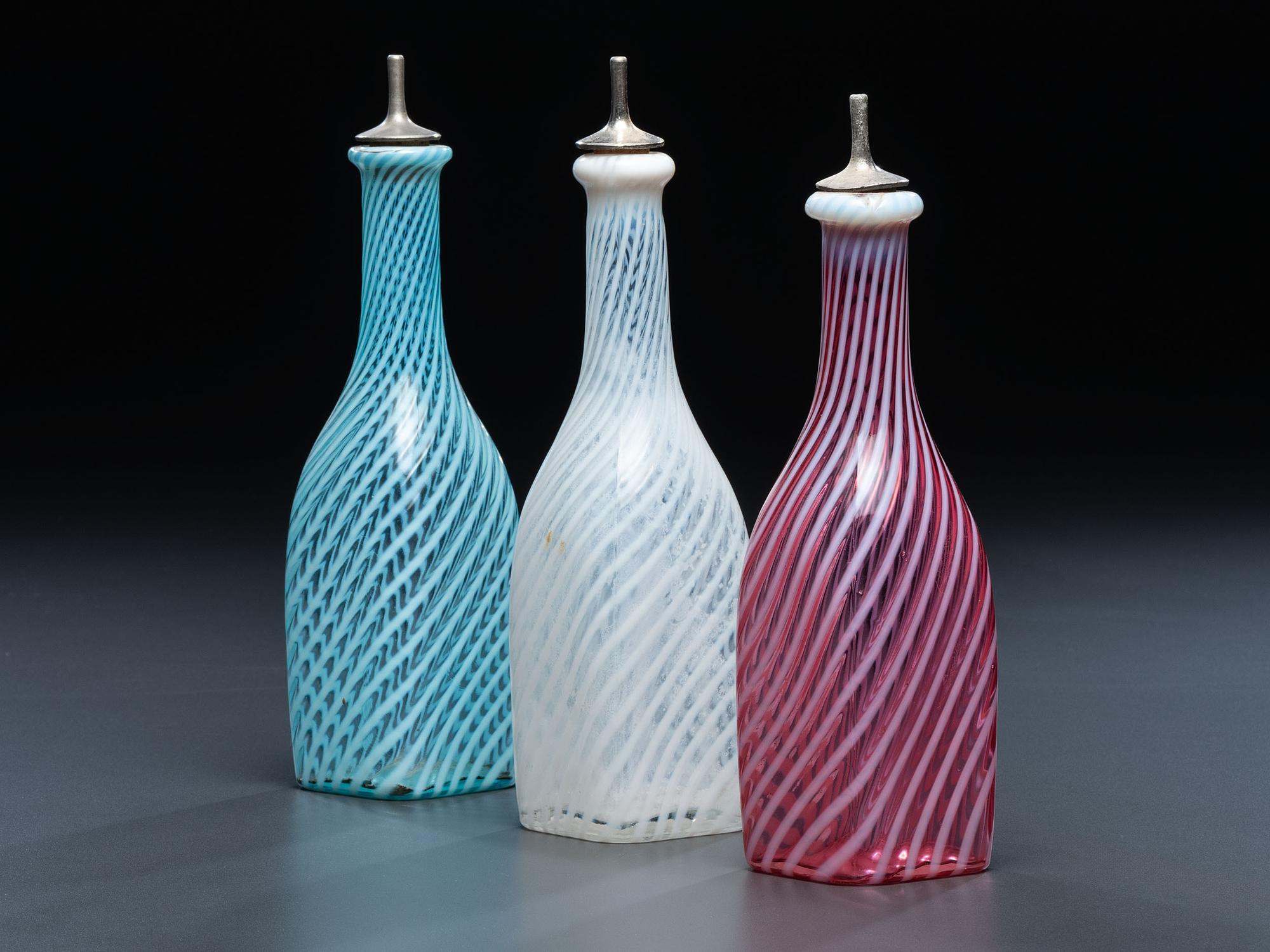 Three Swirl Opalescent Glass Barber Bottles