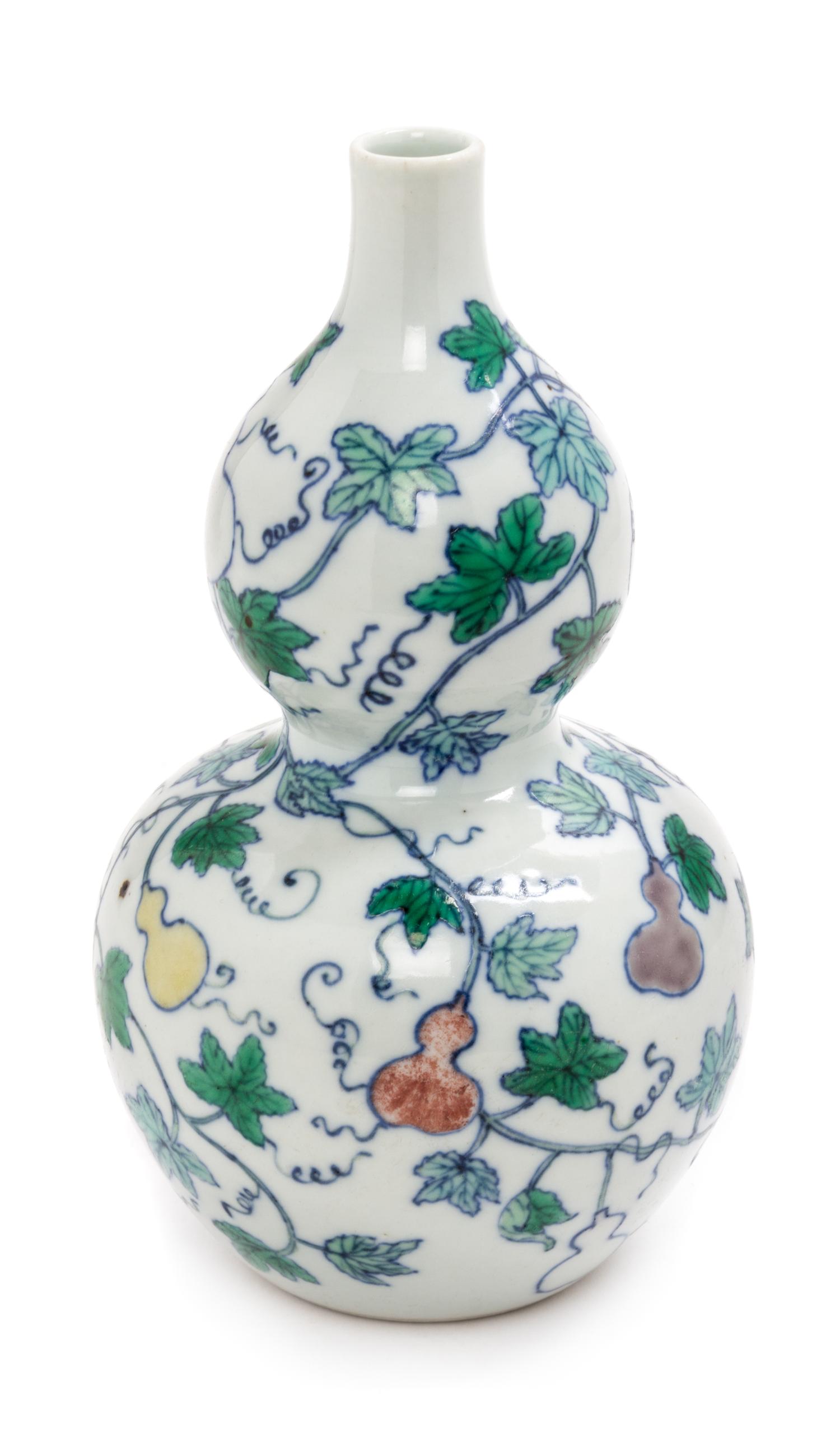 A Doucai Porcelain Gourd-Form Vase Height 7 1/2 inches.