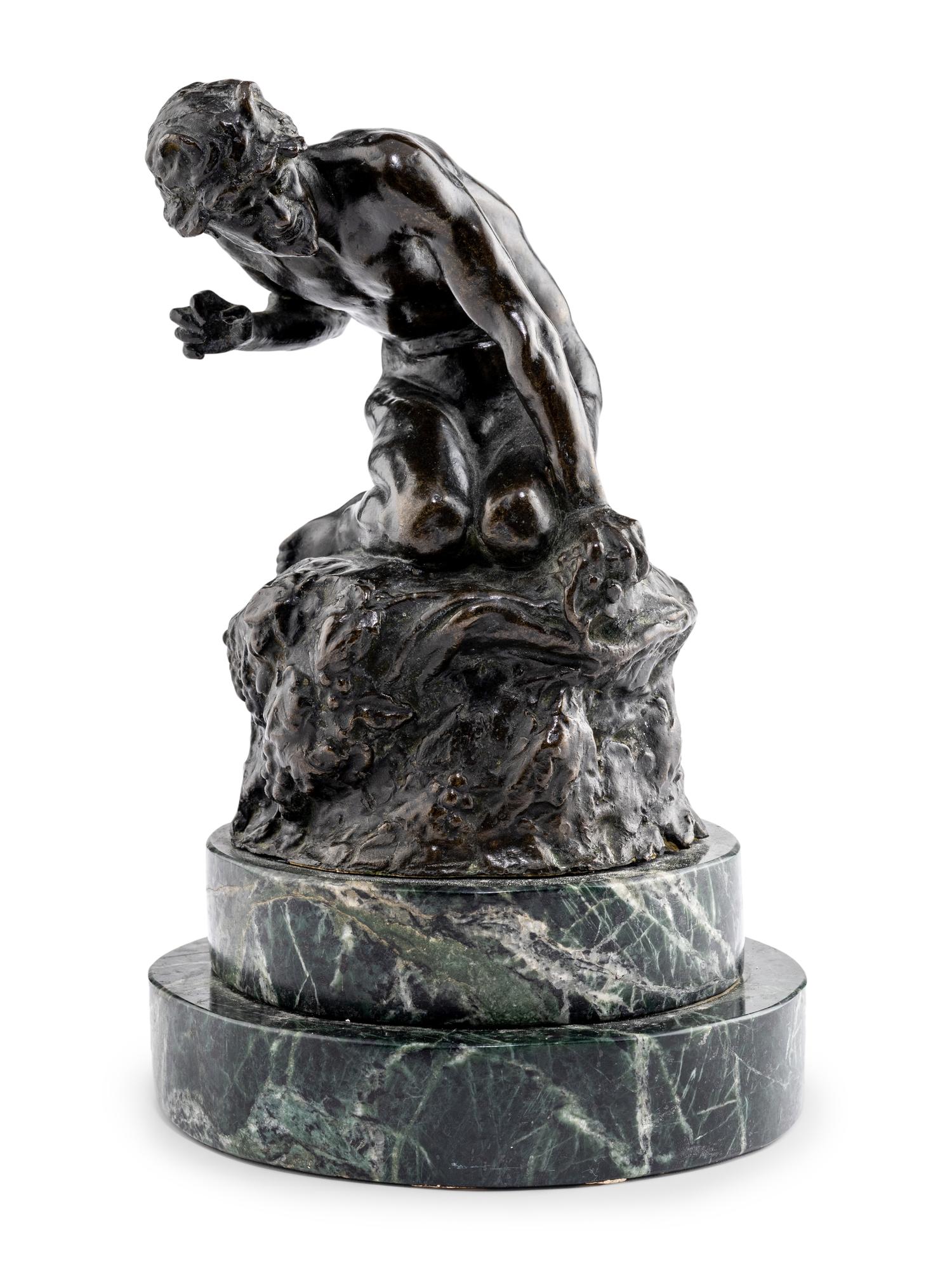 A Bronze Figure of Satyr on the Rocks