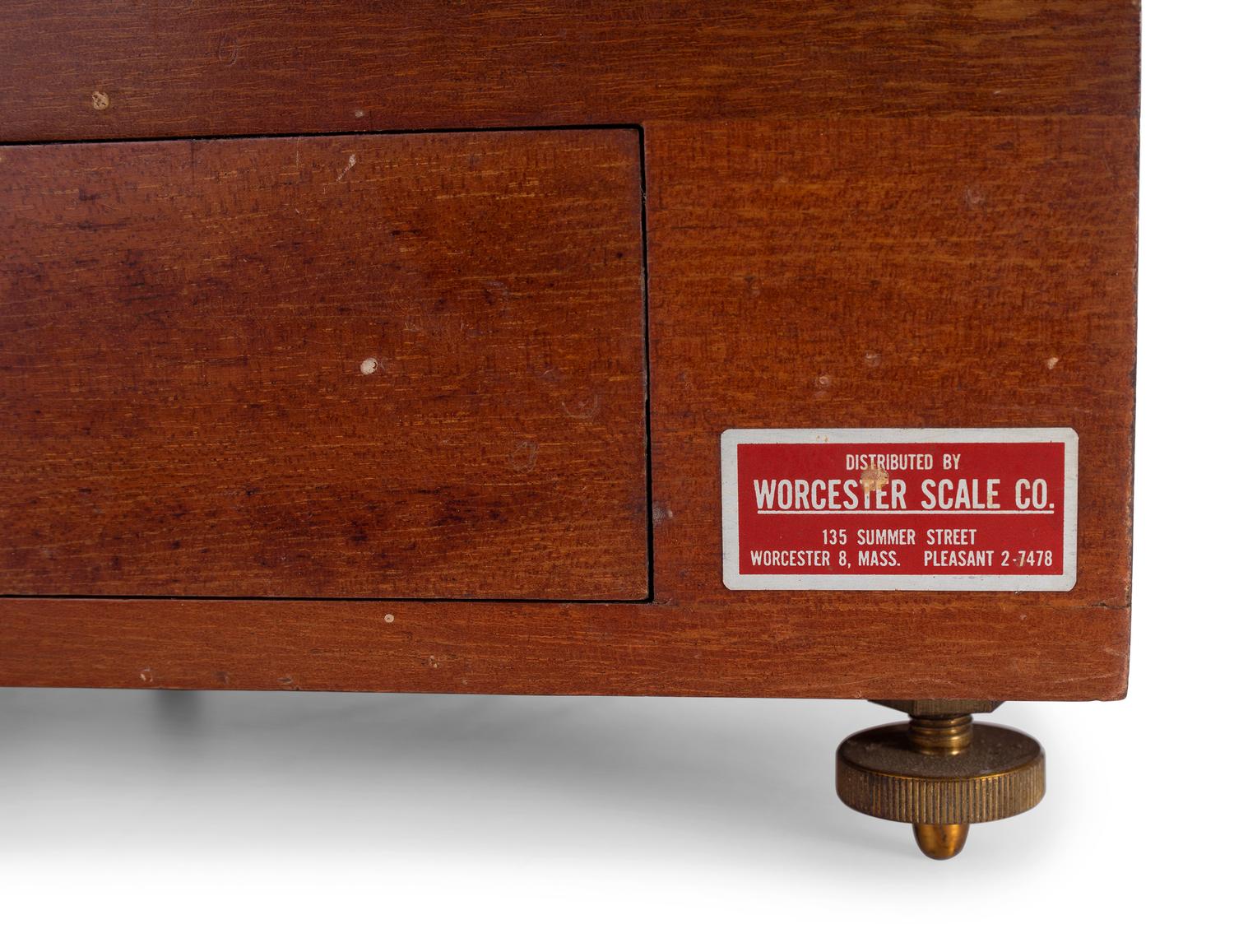 A Central Scientific Co. Scale, an Ingraham Eight-Day Movement Mantle Clock and Framed Salesmen Samples of Blue Grass Axes