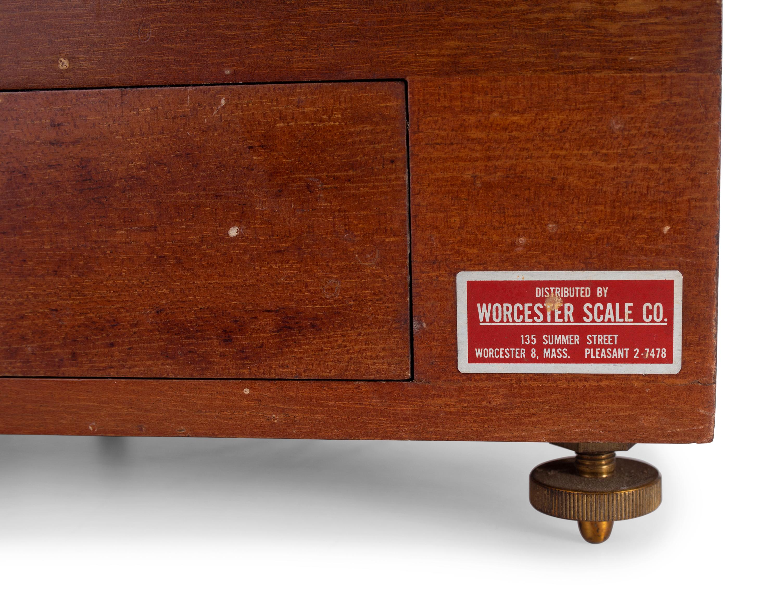 A Central Scientific Co. Scale, an Ingraham Eight-Day Movement Mantle Clock and Framed Salesmen Samples of Blue Grass Axes