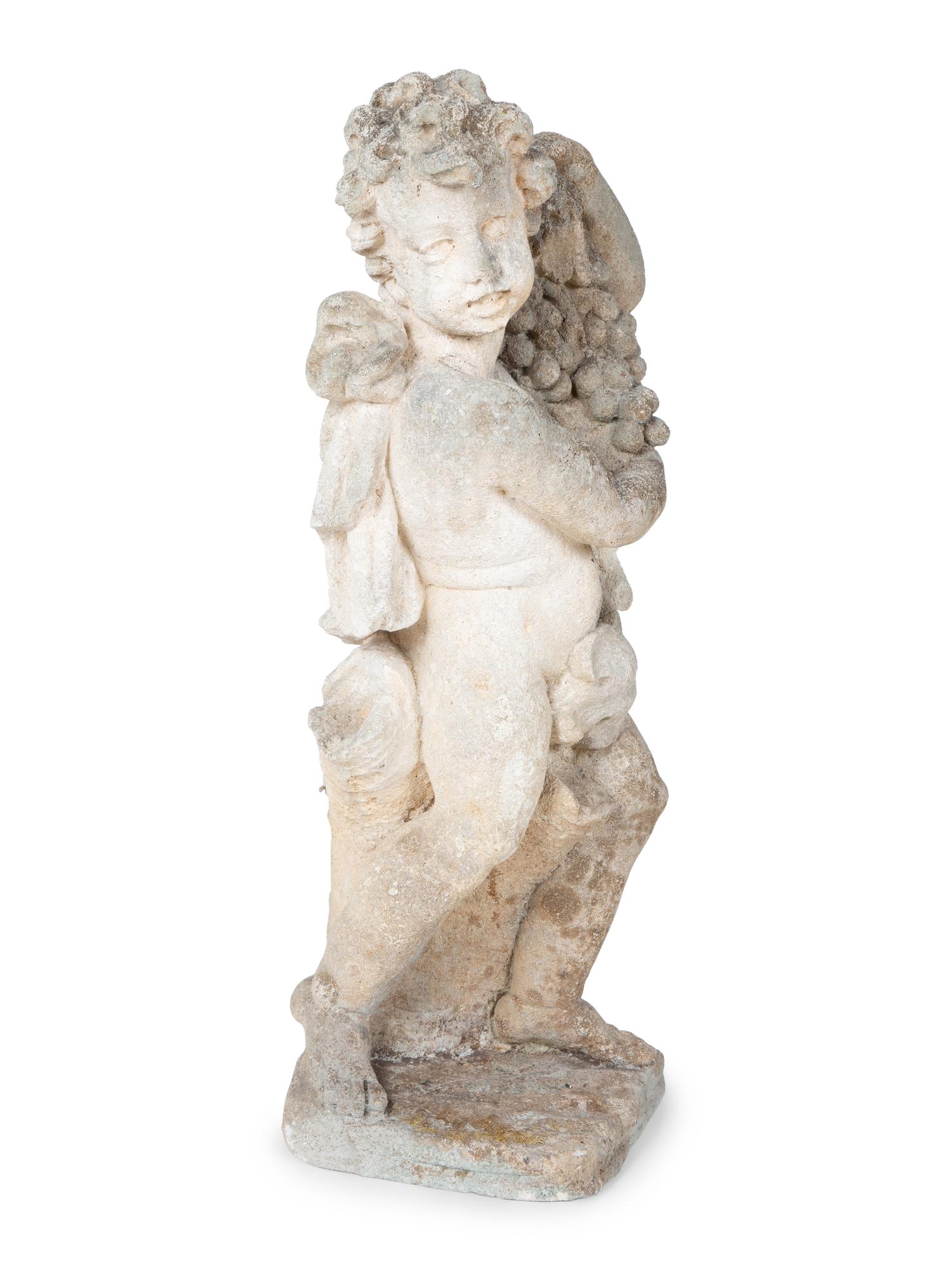 A Cast Stone Figure of Cherub Holding Grapes — 20TH CENTURY