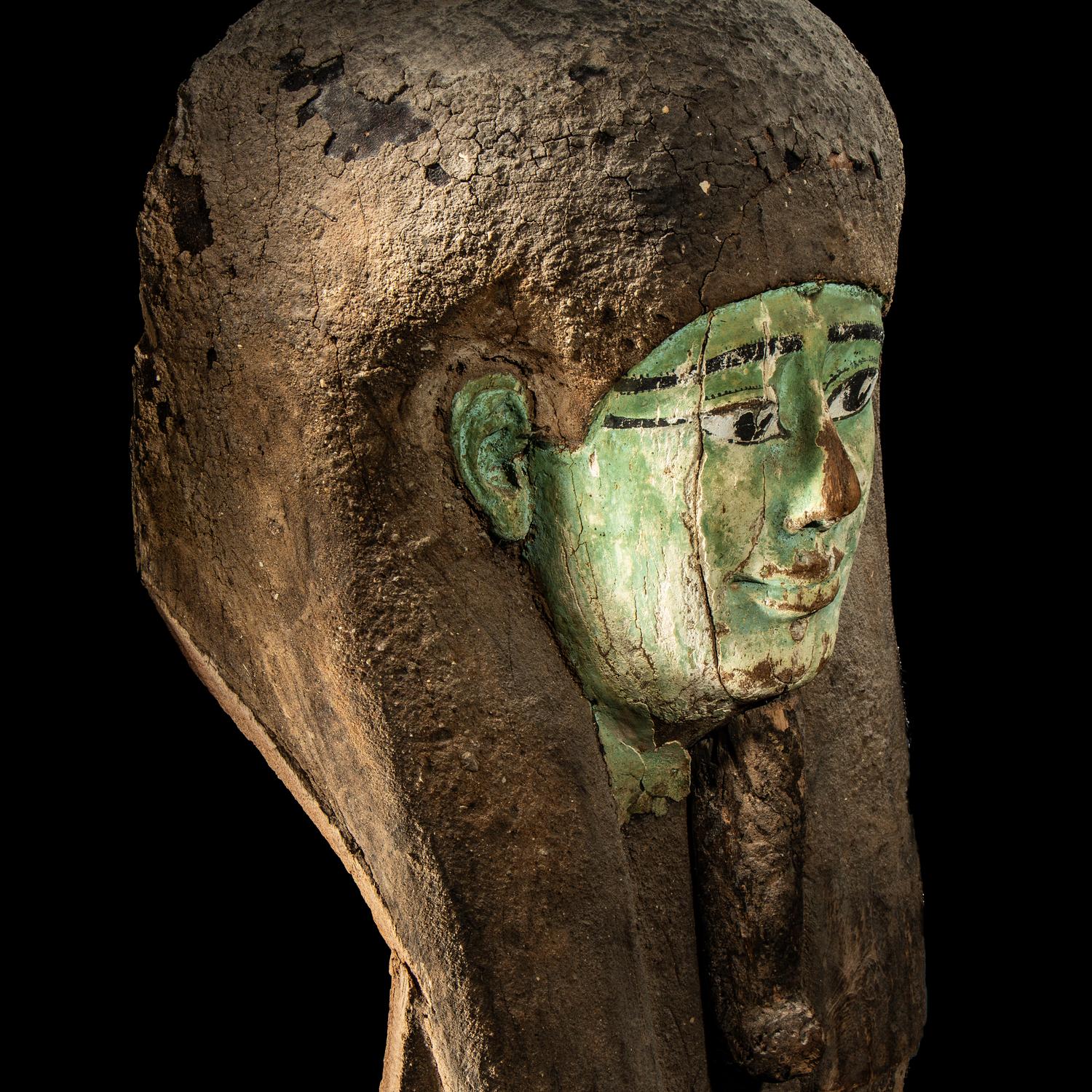 An Egyptian Painted Wood Sarcophagus Head
