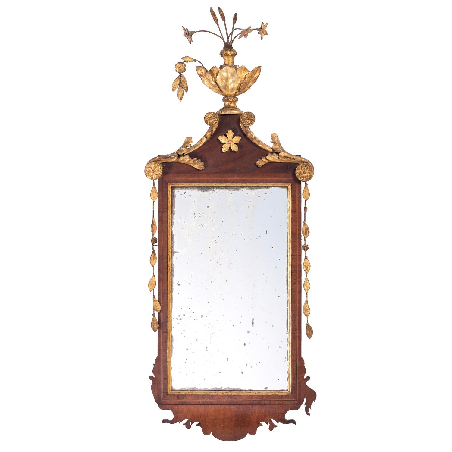 A Federal Parcel-Gilt Mahogany Star and Urn Decorated Looking Glass