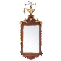 A Federal Parcel-Gilt Mahogany Star and Urn Decorated Looking Glass