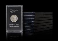 A Group of Eight United States 1883-CC GSA Uncirculated Morgan Silver Dollars