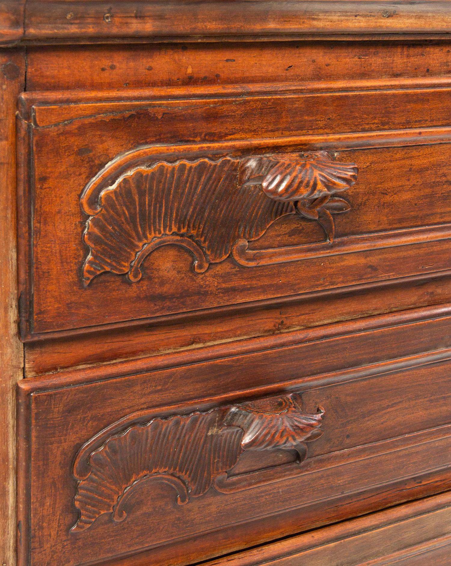 A Louis XV Carved Walnut Cabinet