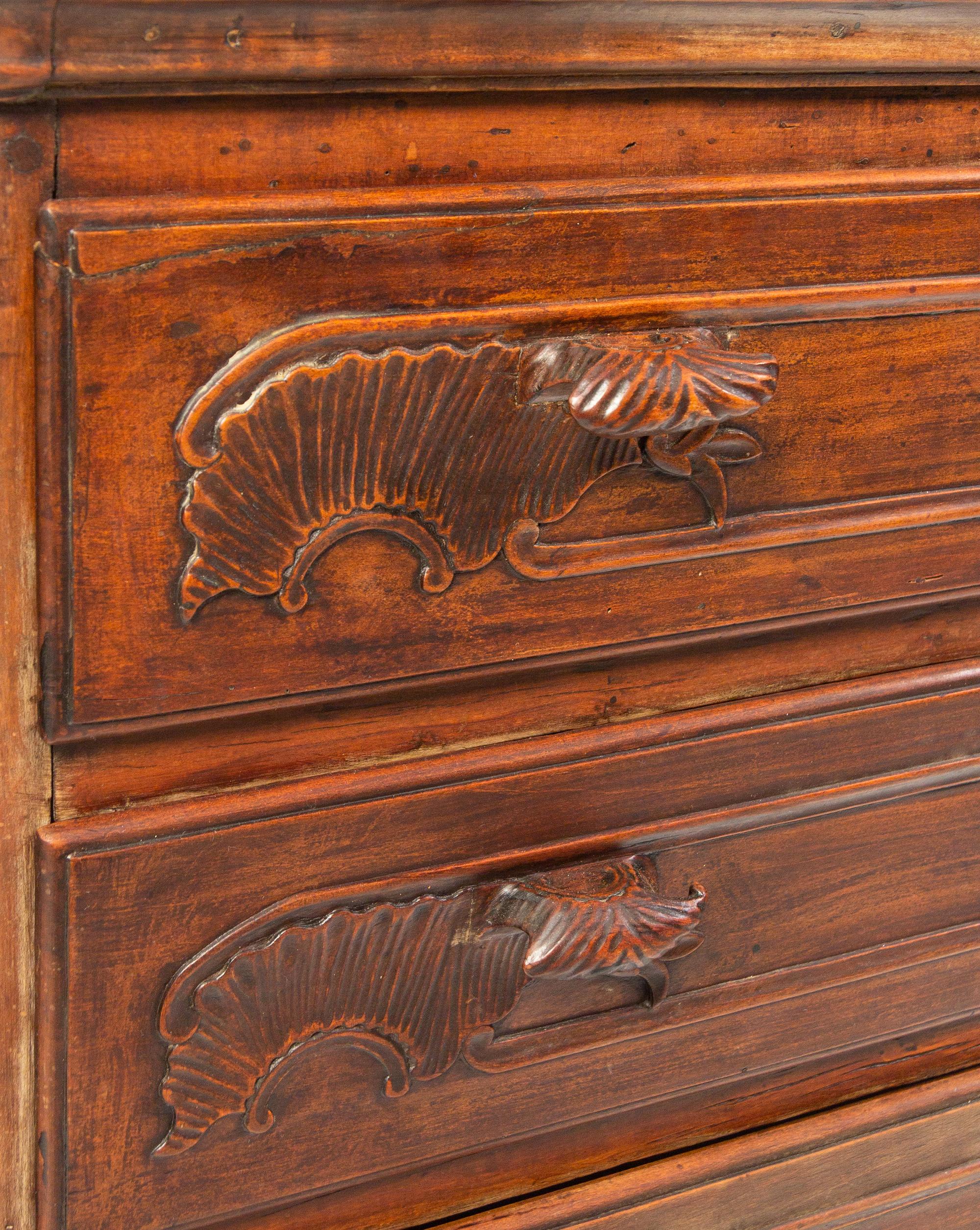 A Louis XV Carved Walnut Cabinet