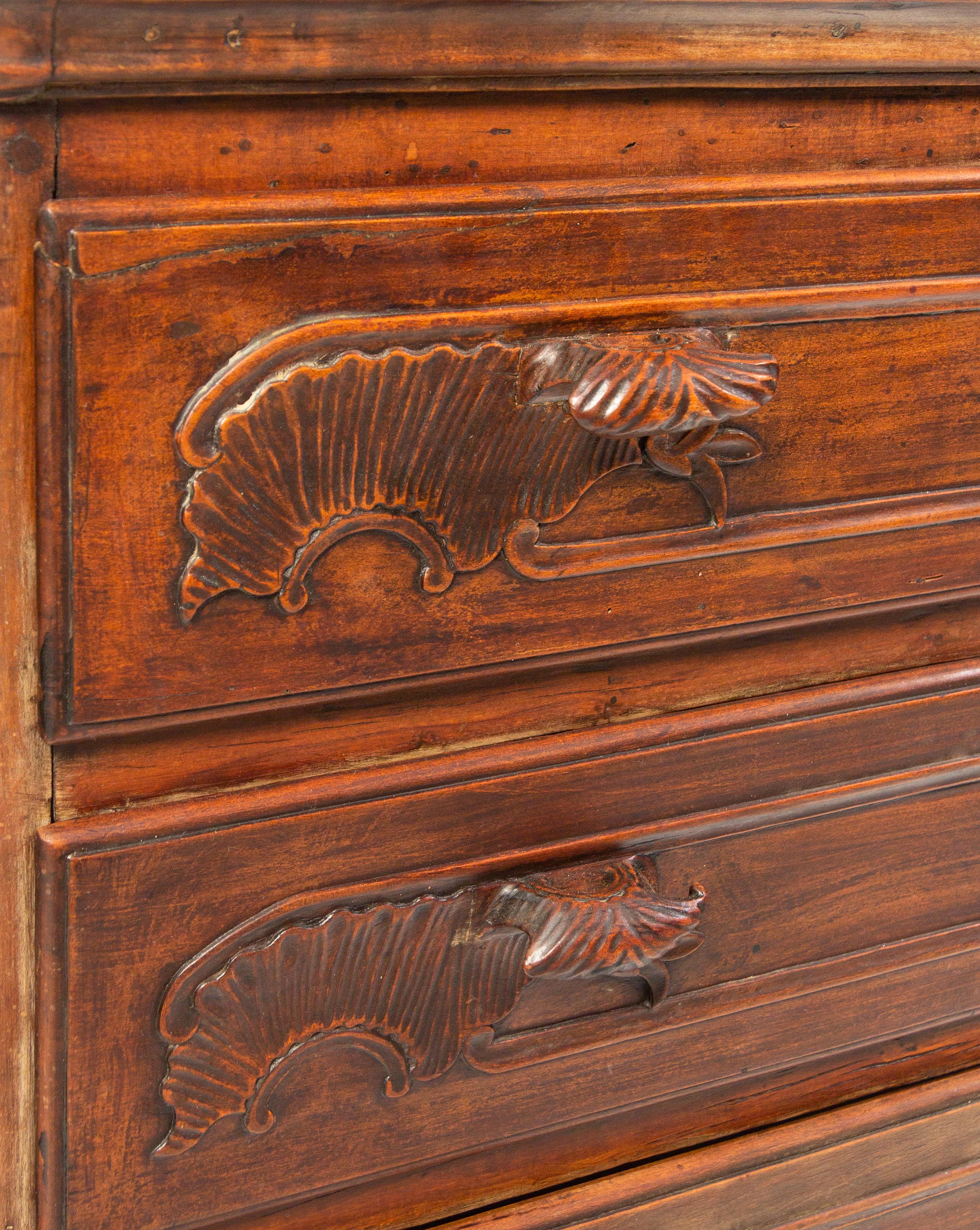 A Louis XV Carved Walnut Cabinet