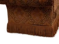 A Chesterfield Style Velvet-Upholstered Sofa with a Fringed Skirt