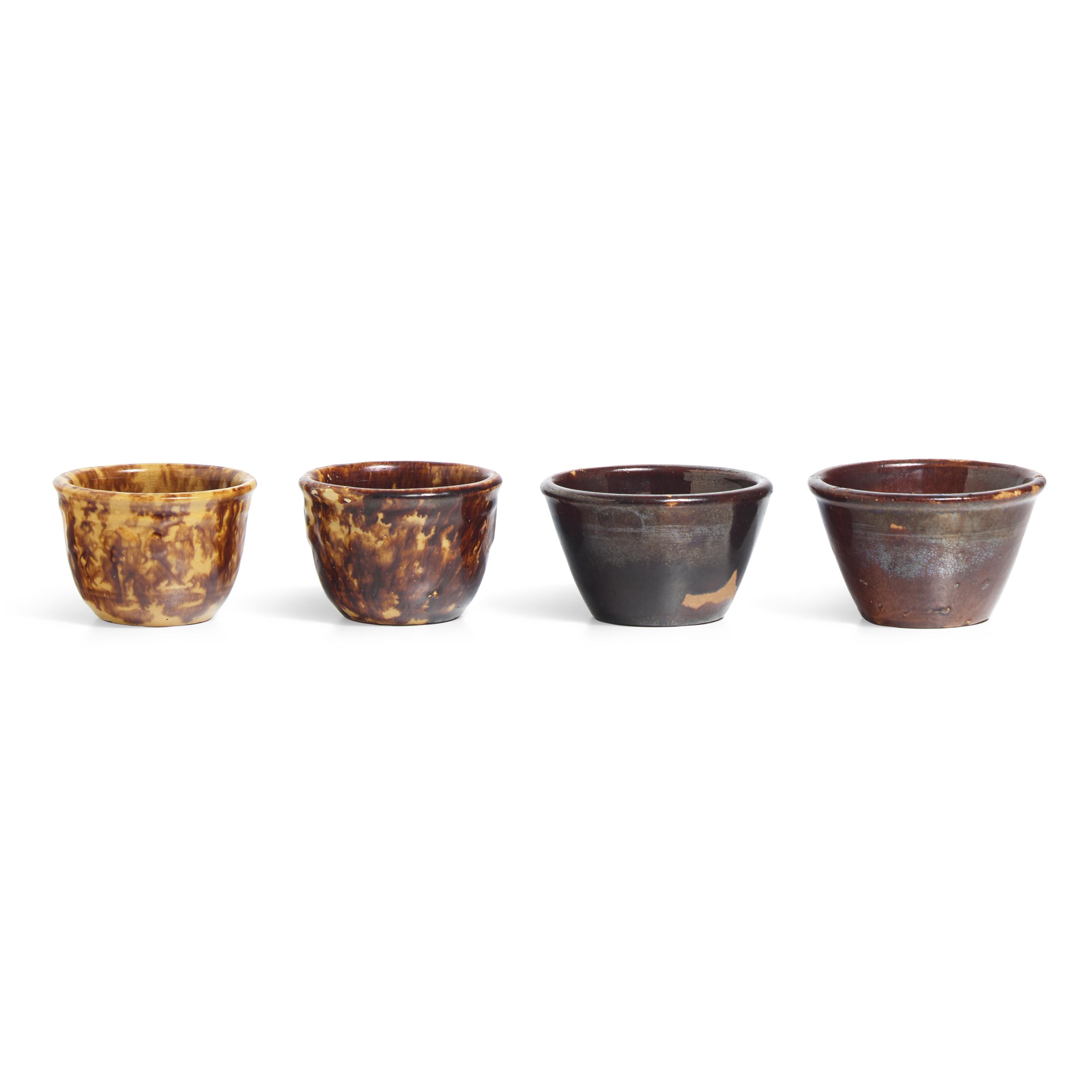 A Group of Fourteen Bennington or Rockingham Glazed Earthenware Items