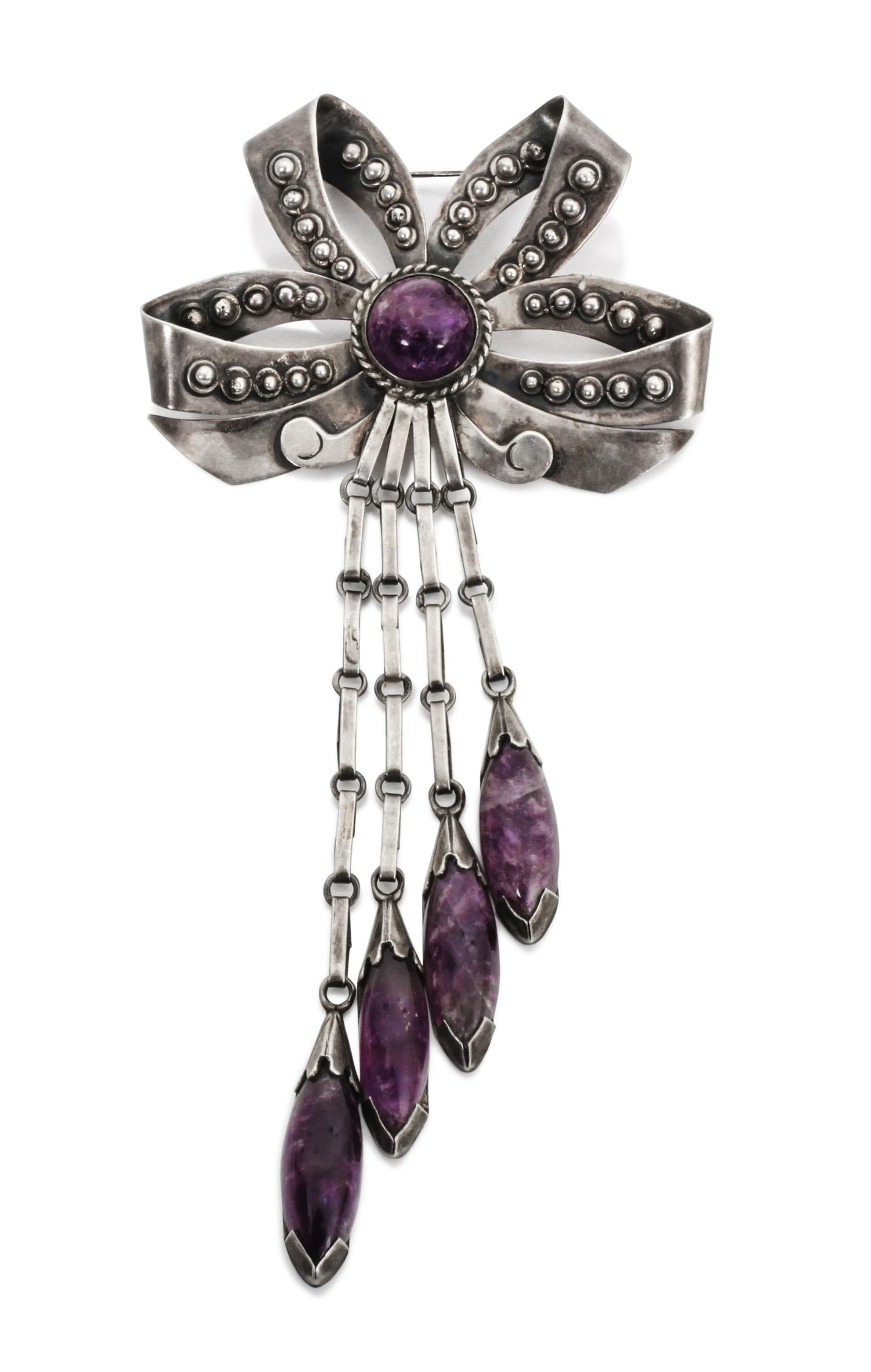 A Mexican Silver and Amethyst Brooch Length 6 1/4 inches.