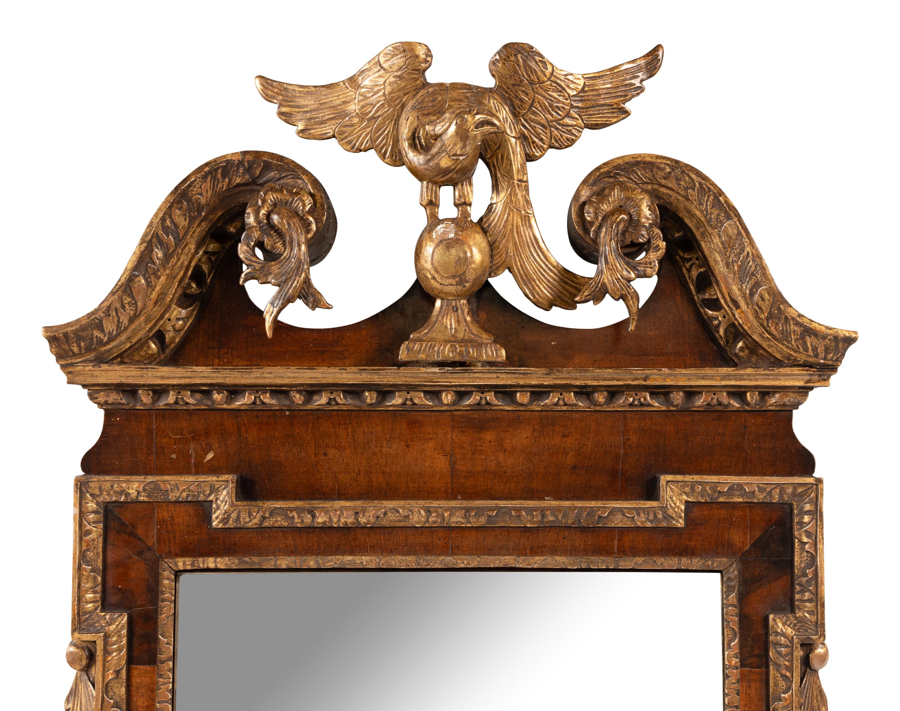 A George II Walnut and Parcel Gilt Mirror