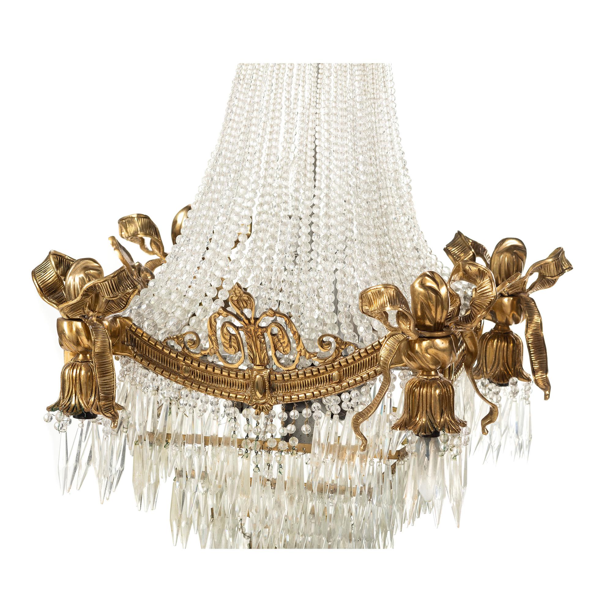 A Louis XVI Style Gilt Metal and Cut Glass Chandelier