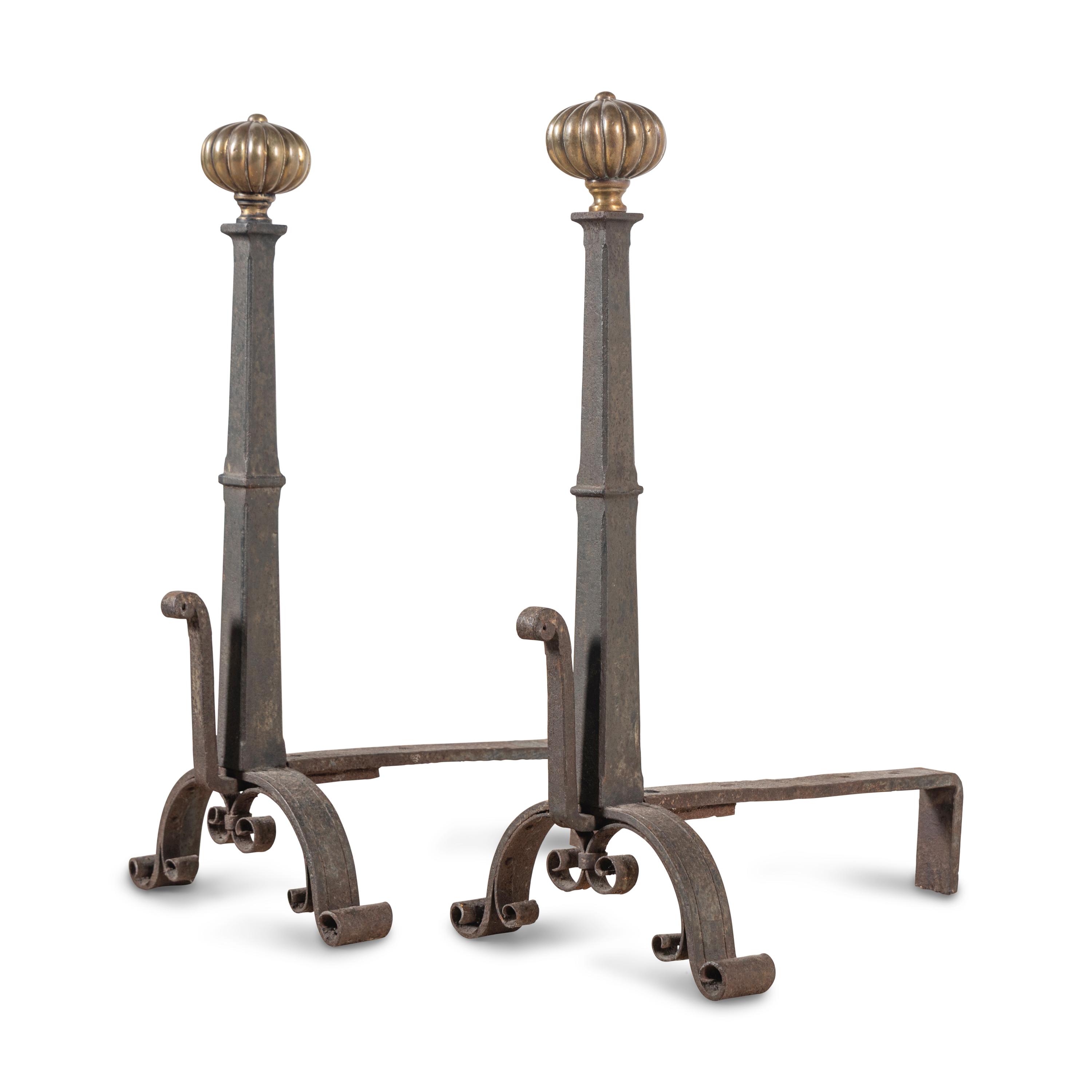 A Pair of Continental Iron and Brass Andirons