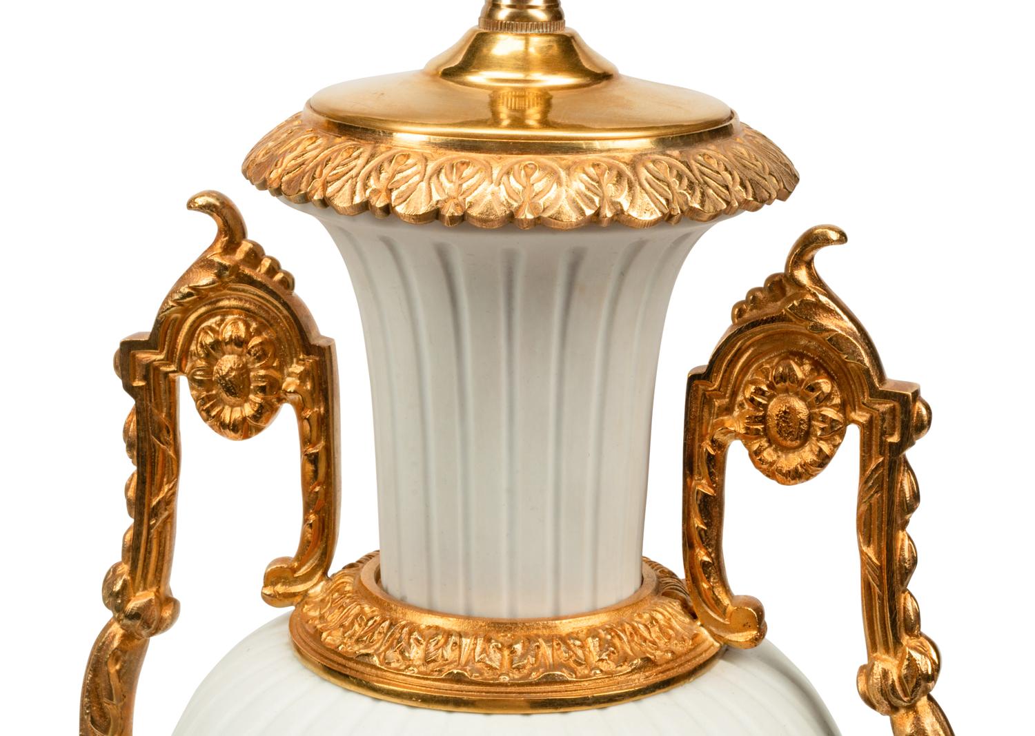 A Pair of Gilt Metal Mounted Bisque Porcelain Lamps