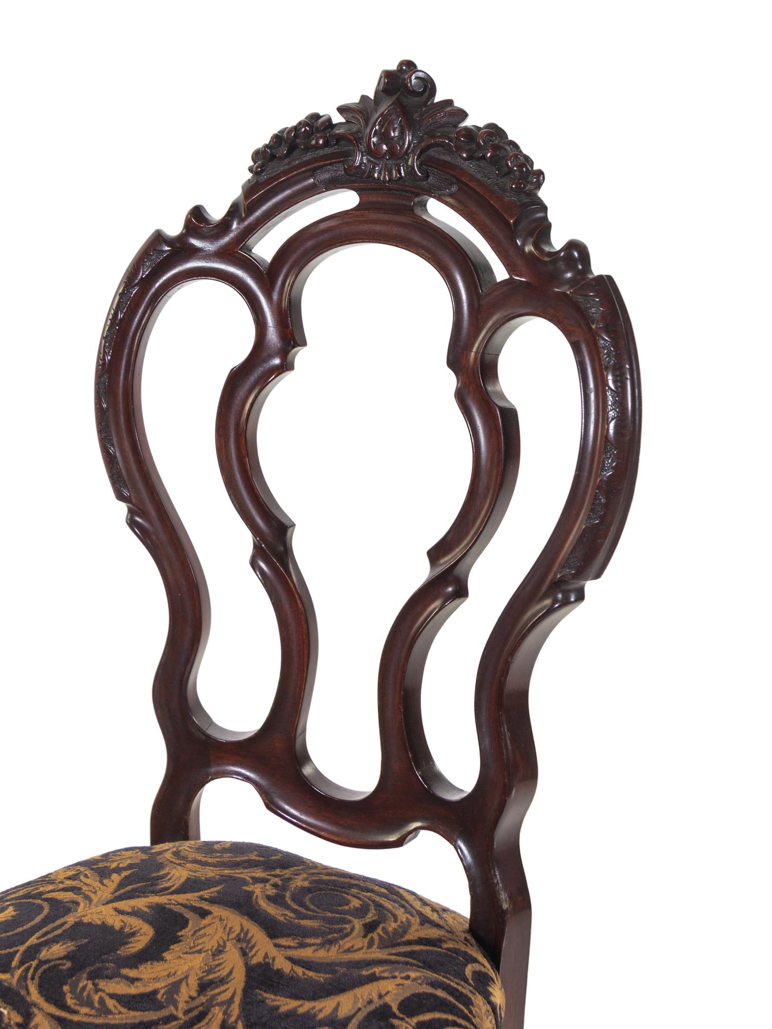 A Set of Four Rococo Revival Mahogany Side Chairs