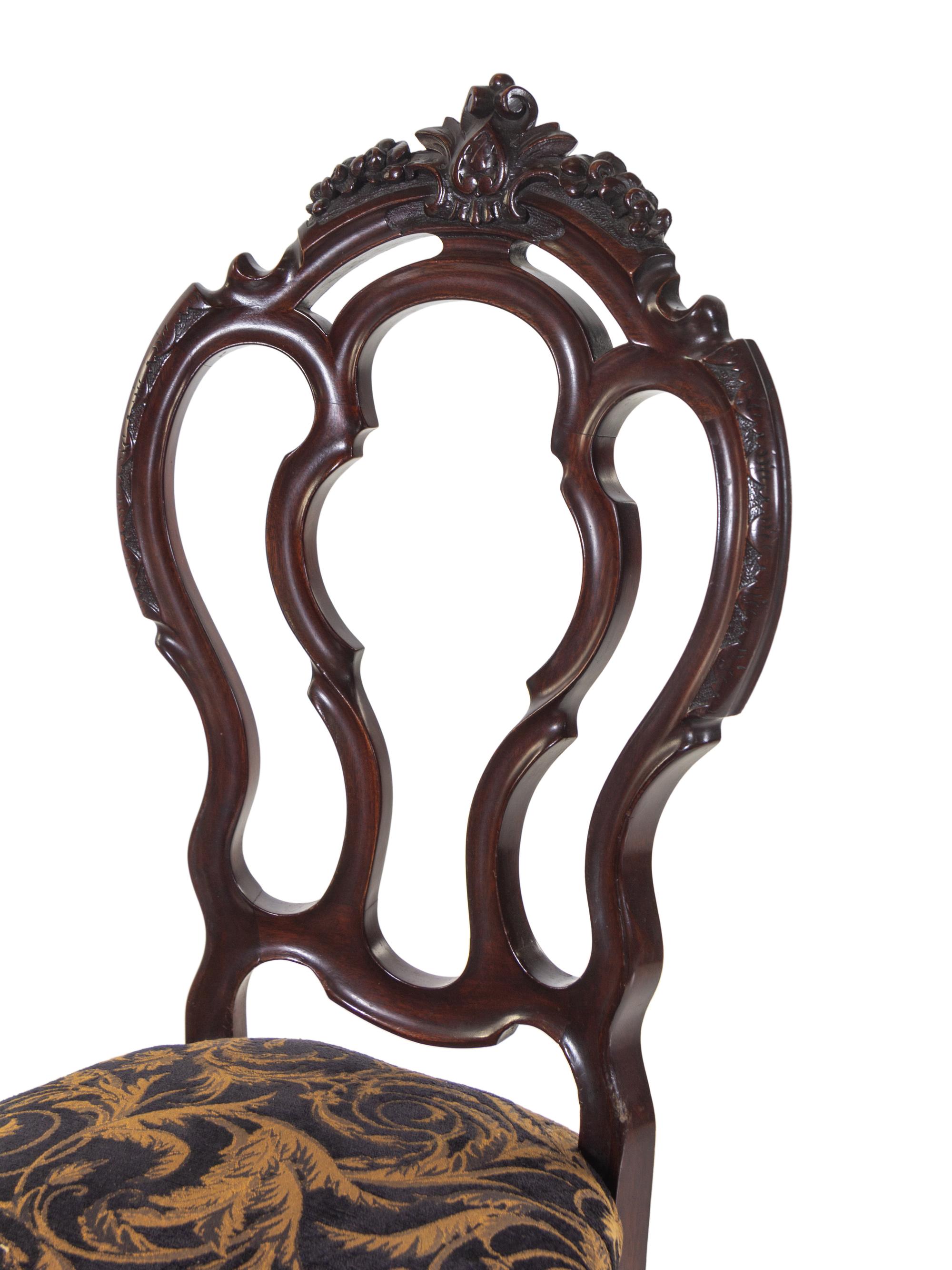 A Set of Four Rococo Revival Mahogany Side Chairs