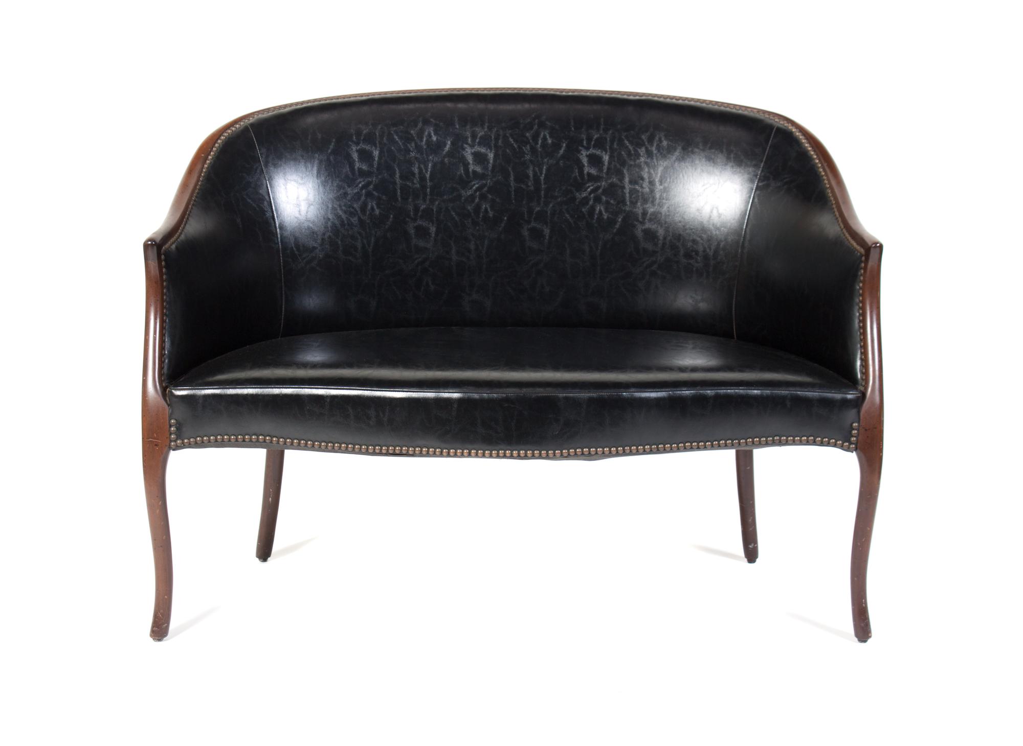 An American Upholstered Settee Height 29 1/4 x width 46 1/2 x depth 22 inches.
