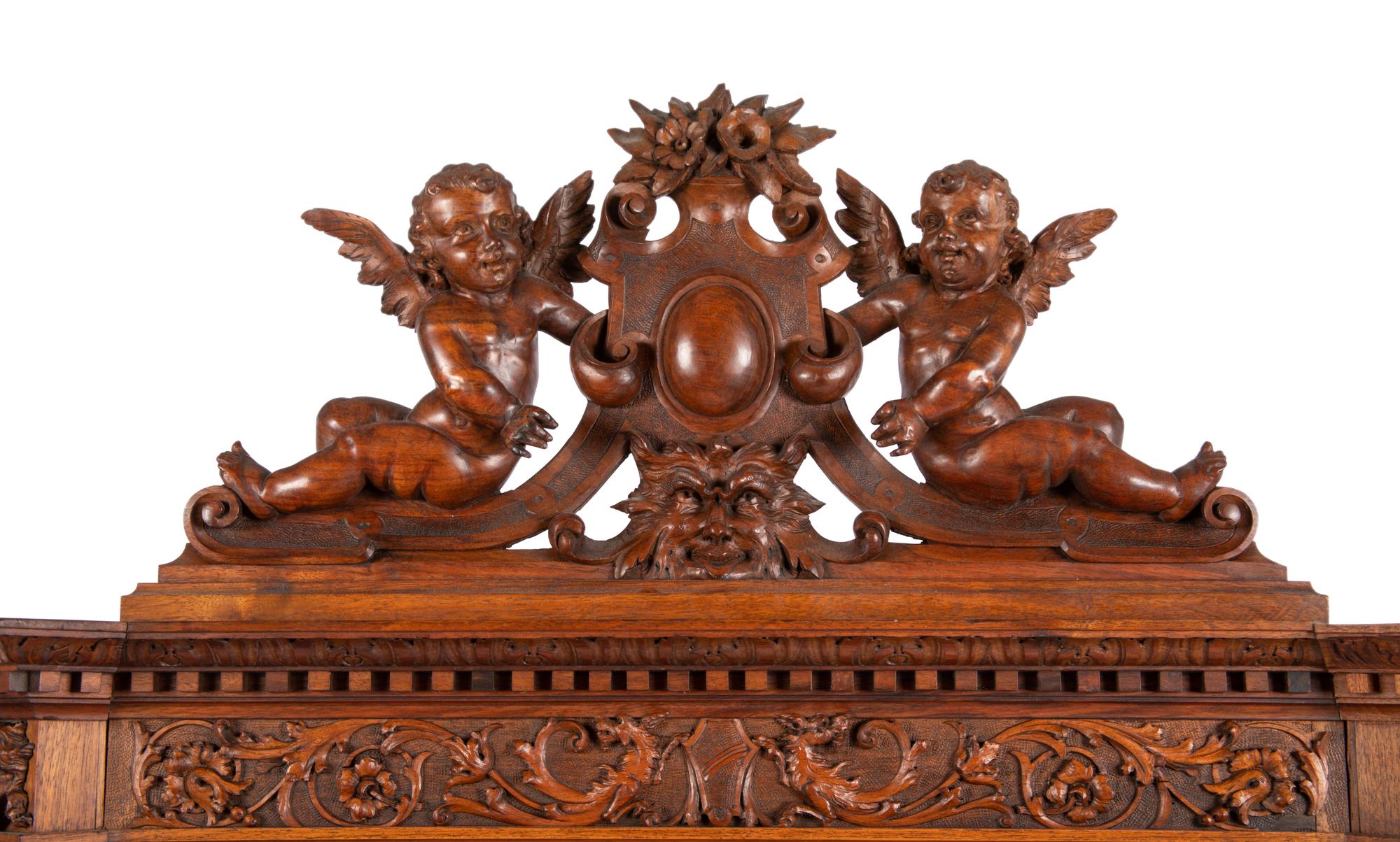 A Renaissance Revival Carved Walnut Cabinet In the Manner of Alexander Roux