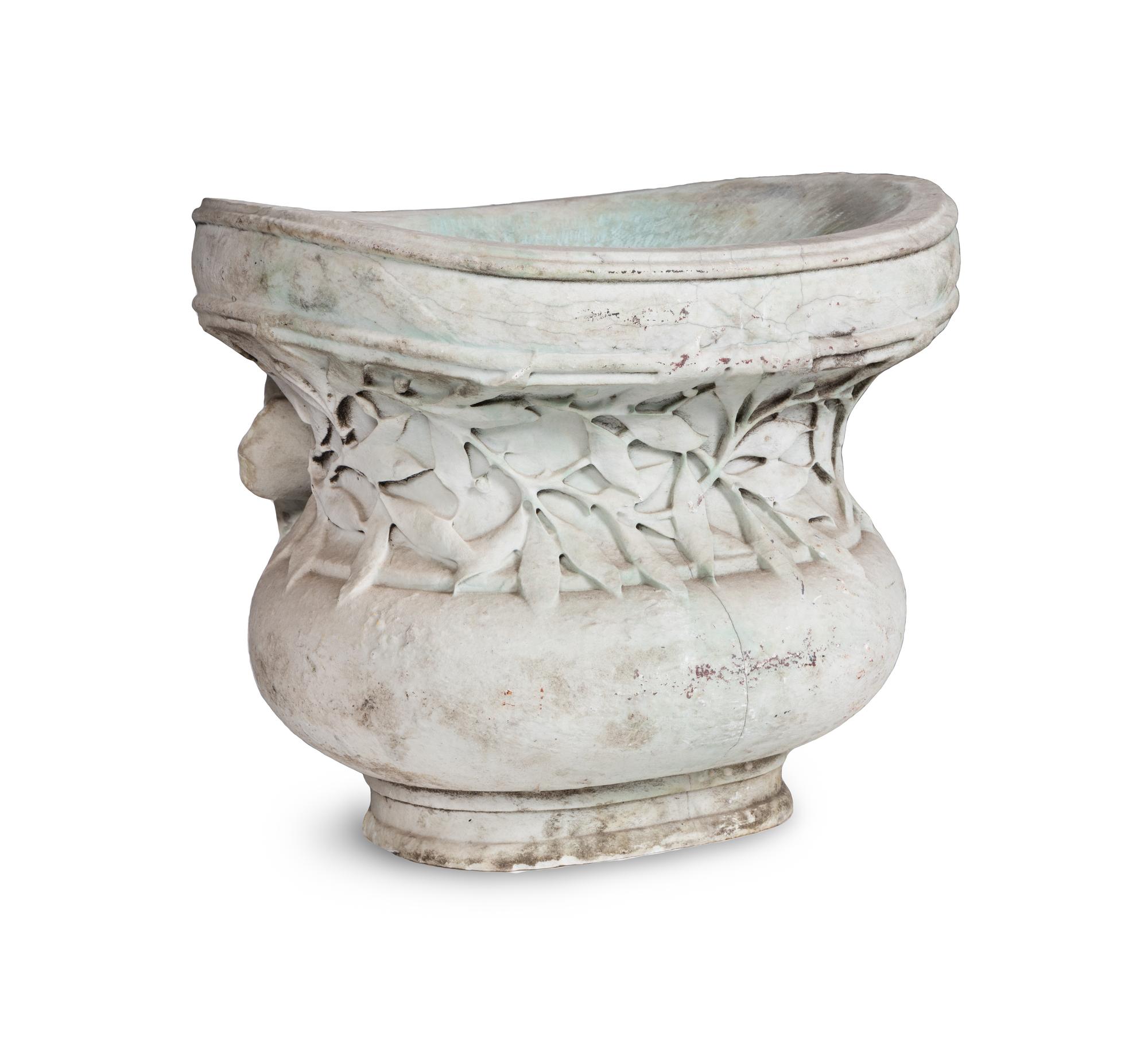 A Carved Variegated Marble Jardinière