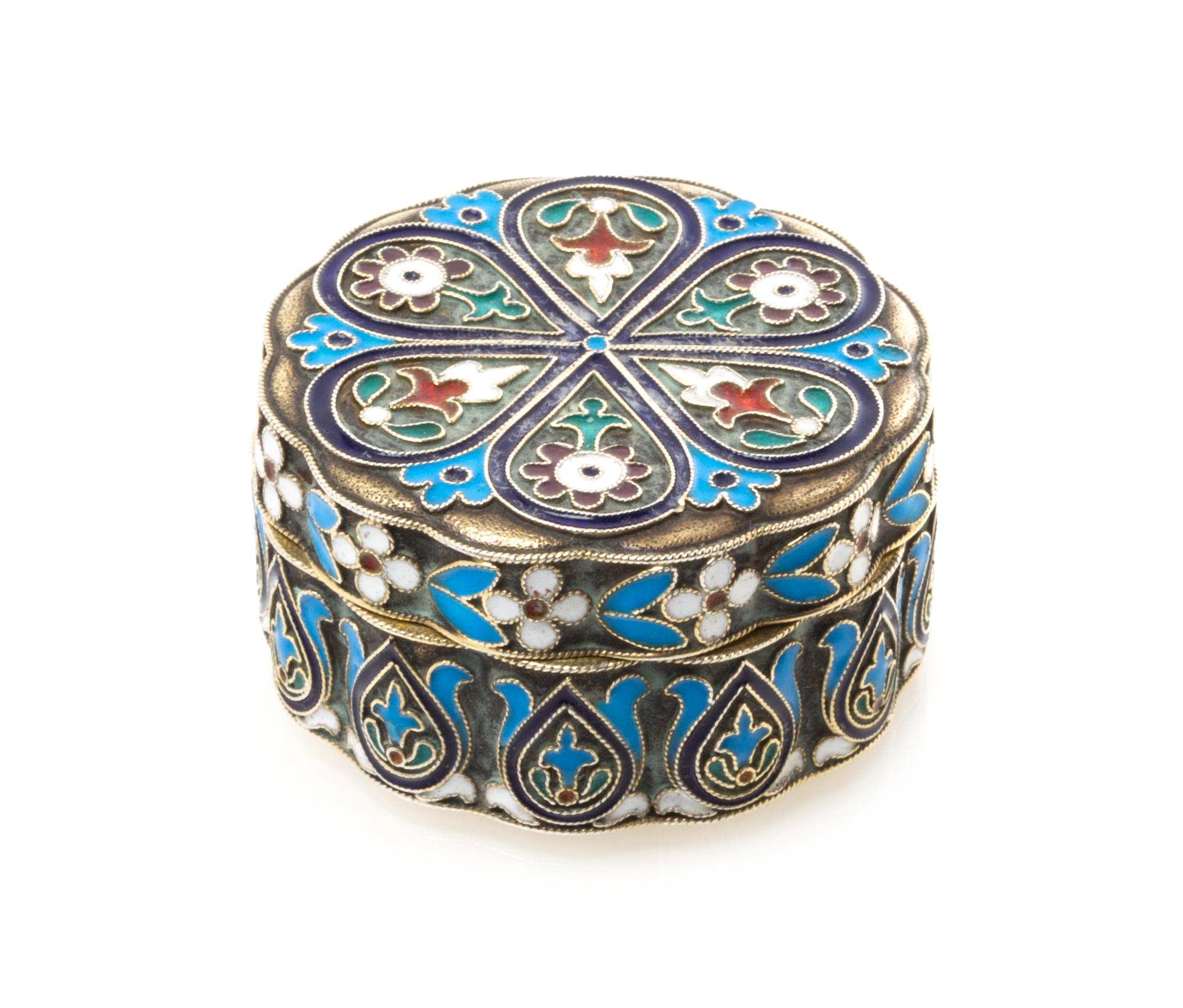 A Russian Silver and Enamel Pill Box, Maker's mark Cyrillic IS, city mark likely Odessa, of lobed, circular form and decorated with pol